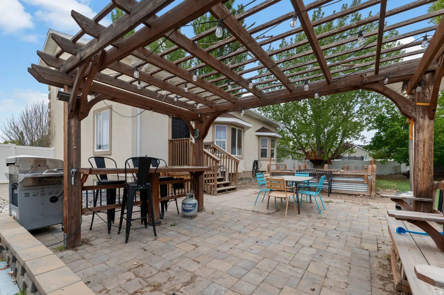 View of patio / terrace with outdoor dining space, area for grilling, and a pergola