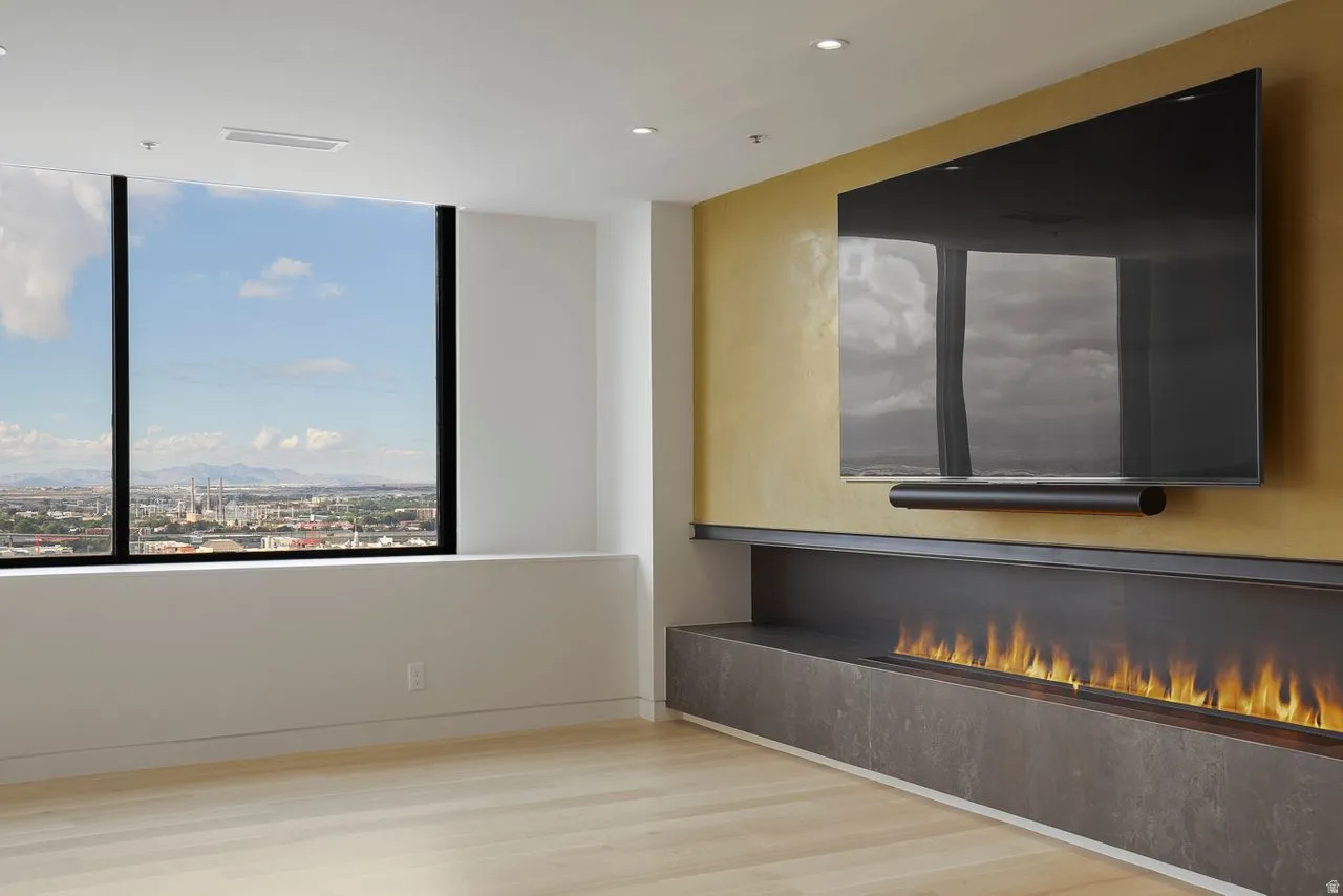 Spare room with light wood finished floors and recessed lighting