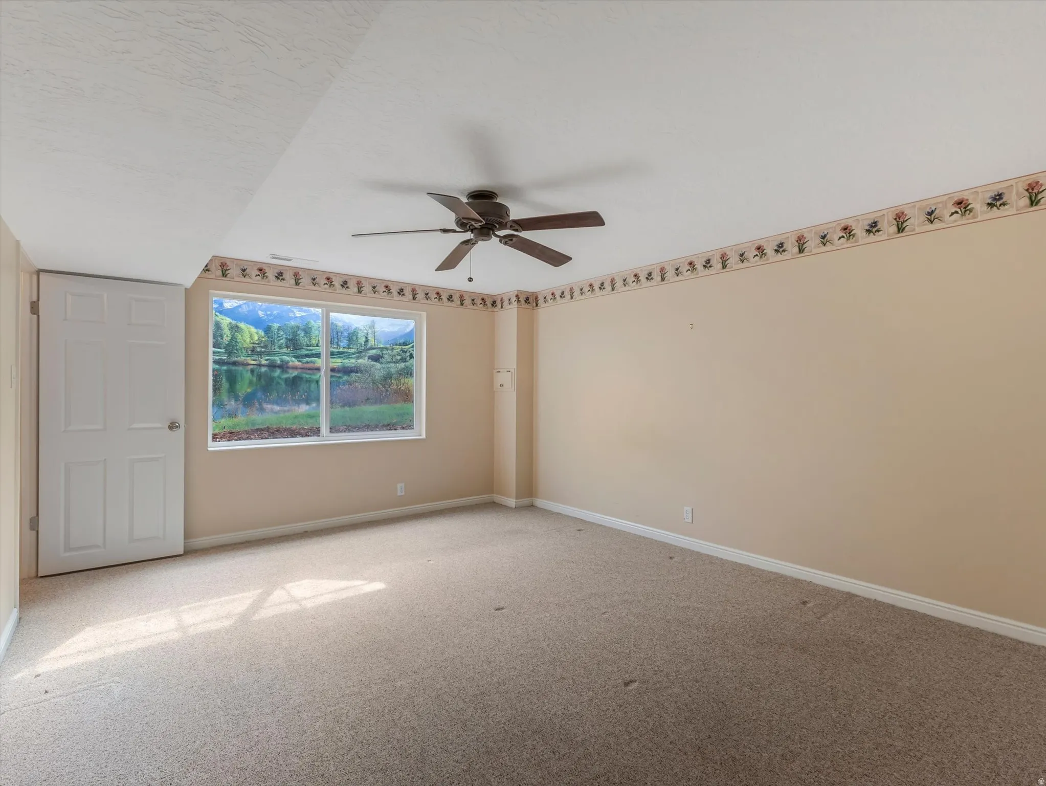 Bedroom down with ceiling fan, large closet