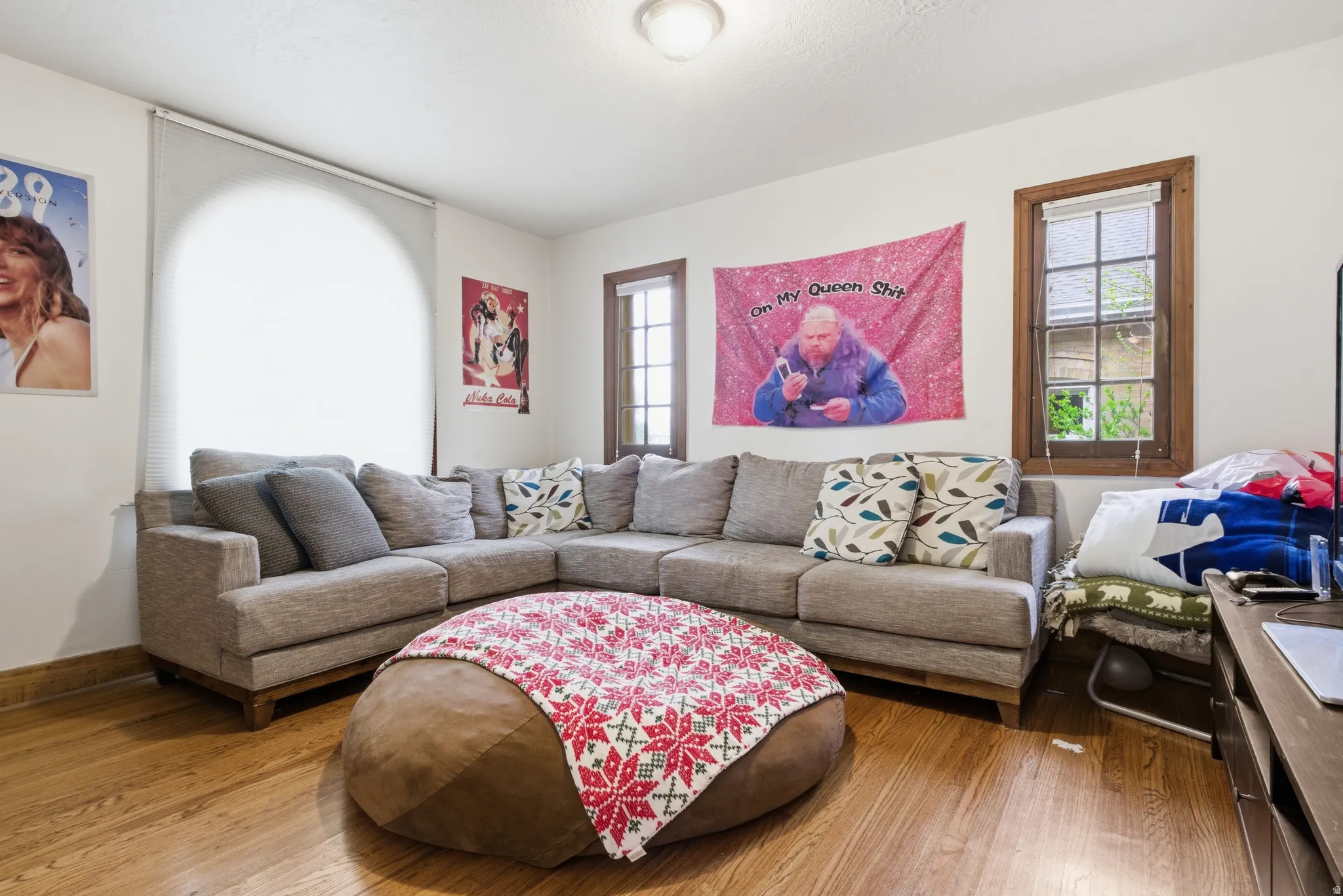 Living room featuring hardwood / wood-style floors and baseboards