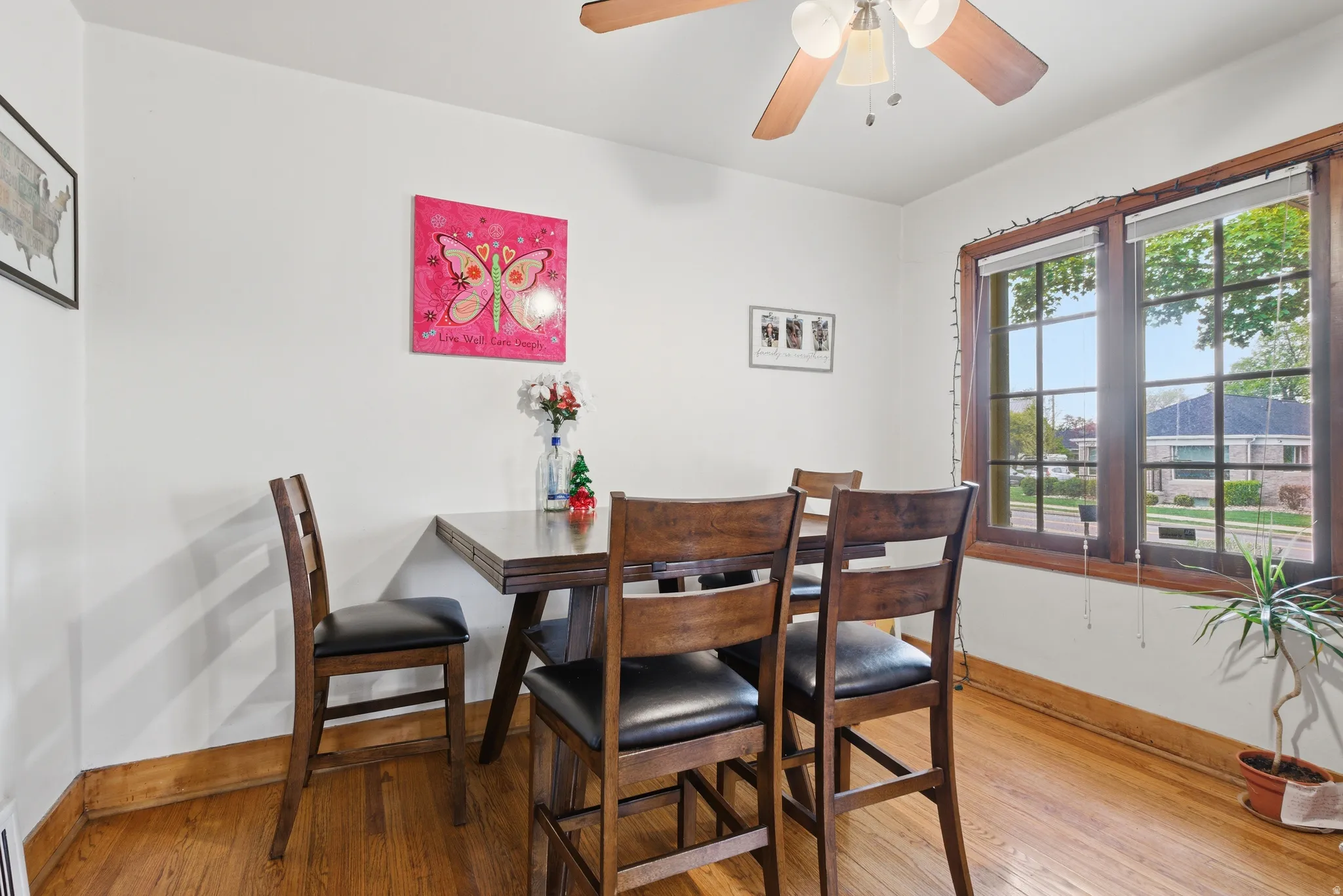 Dining room featuring light wood finished floors and a ceiling fan