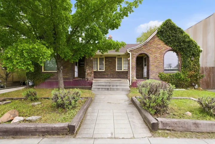 View of front facade featuring brick siding