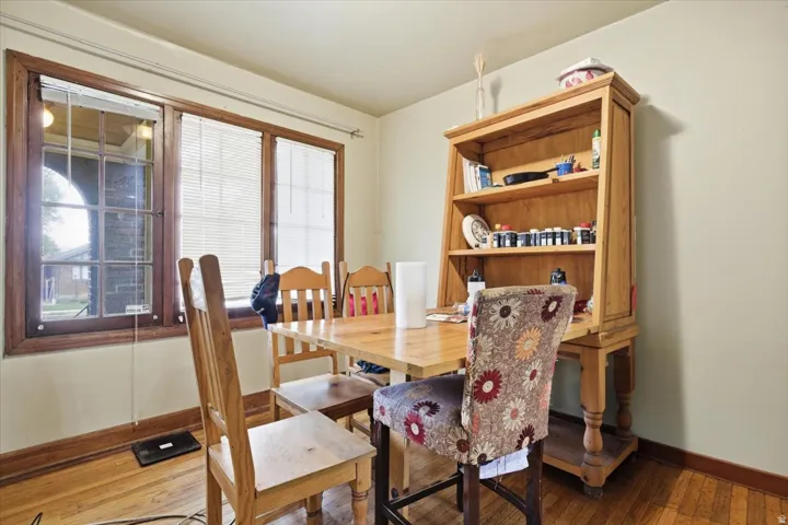 Dining area featuring hardwood / wood-style flooring and baseboards