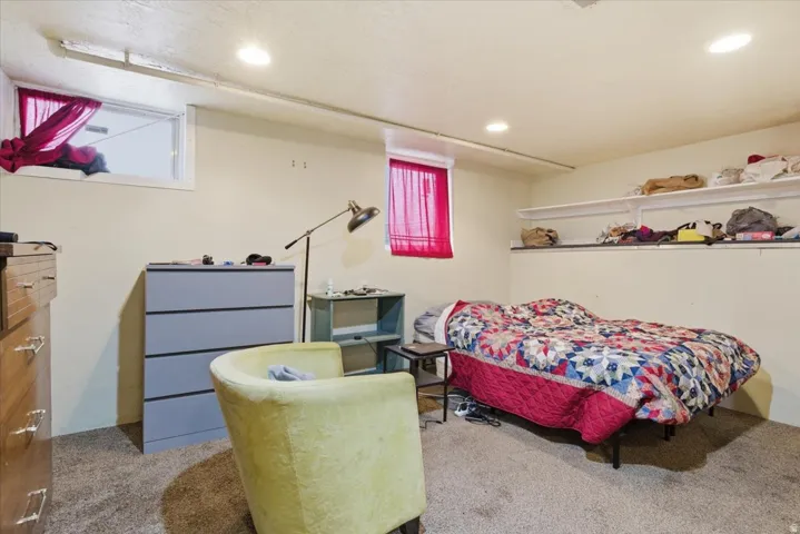 Carpeted bedroom featuring recessed lighting