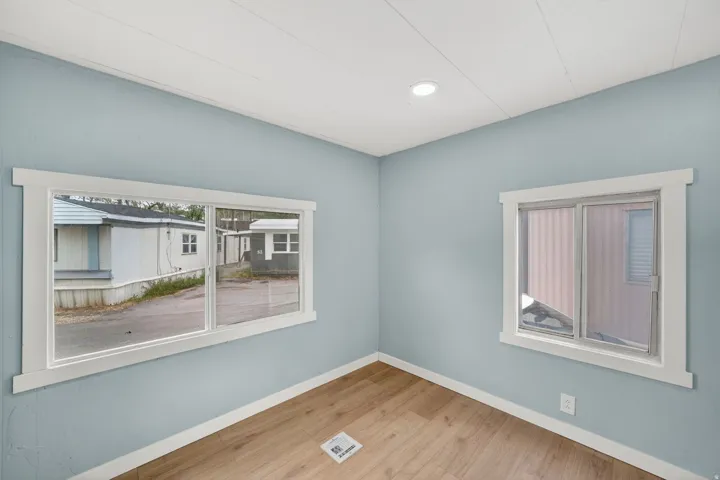 Empty room with light wood-style flooring