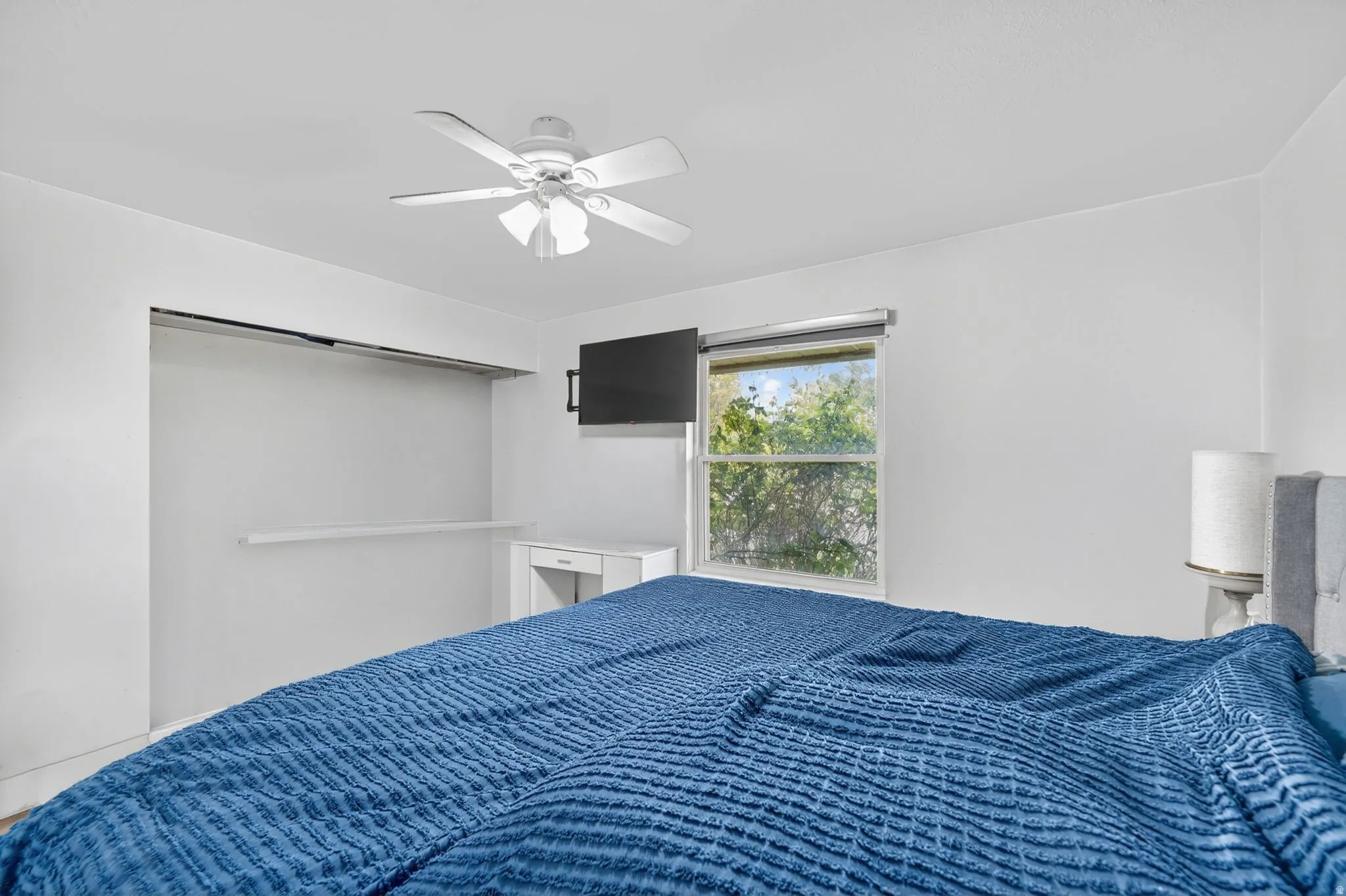 Bedroom featuring a ceiling fan
