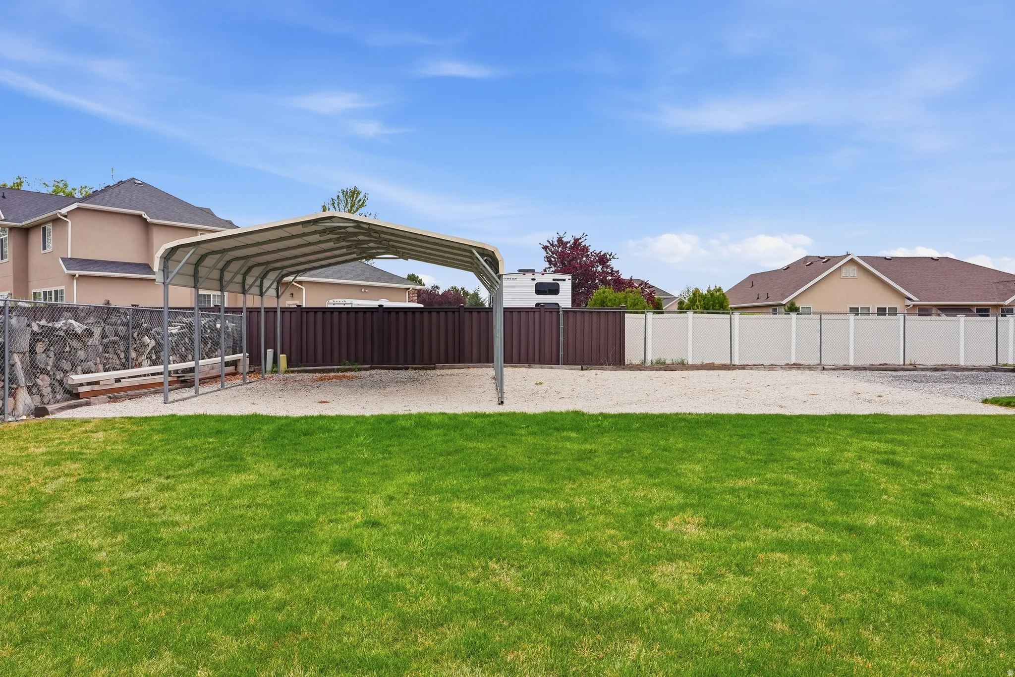 View of yard with a carport and a residential view