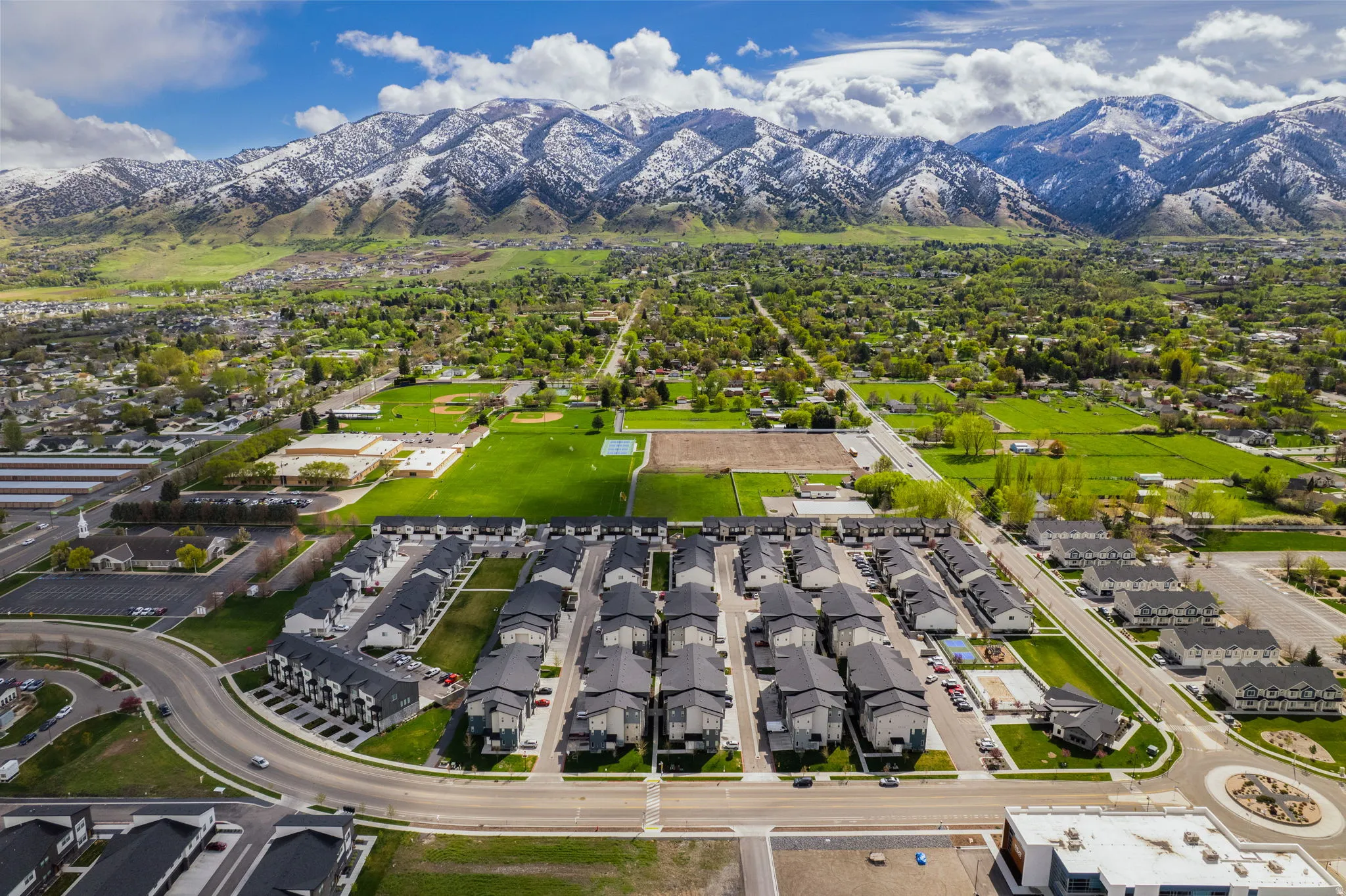 Aerial view of residential area featuring mountains