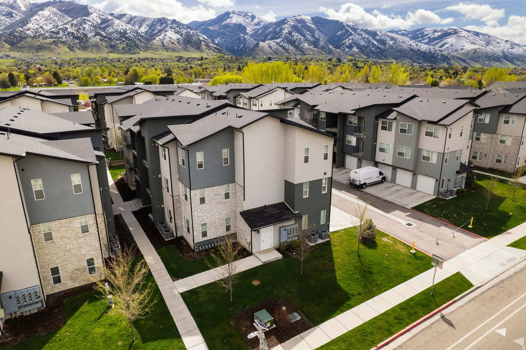 Aerial perspective of suburban area featuring a mountainous background