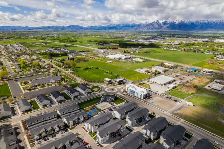 Aerial perspective of suburban area with a mountain backdrop