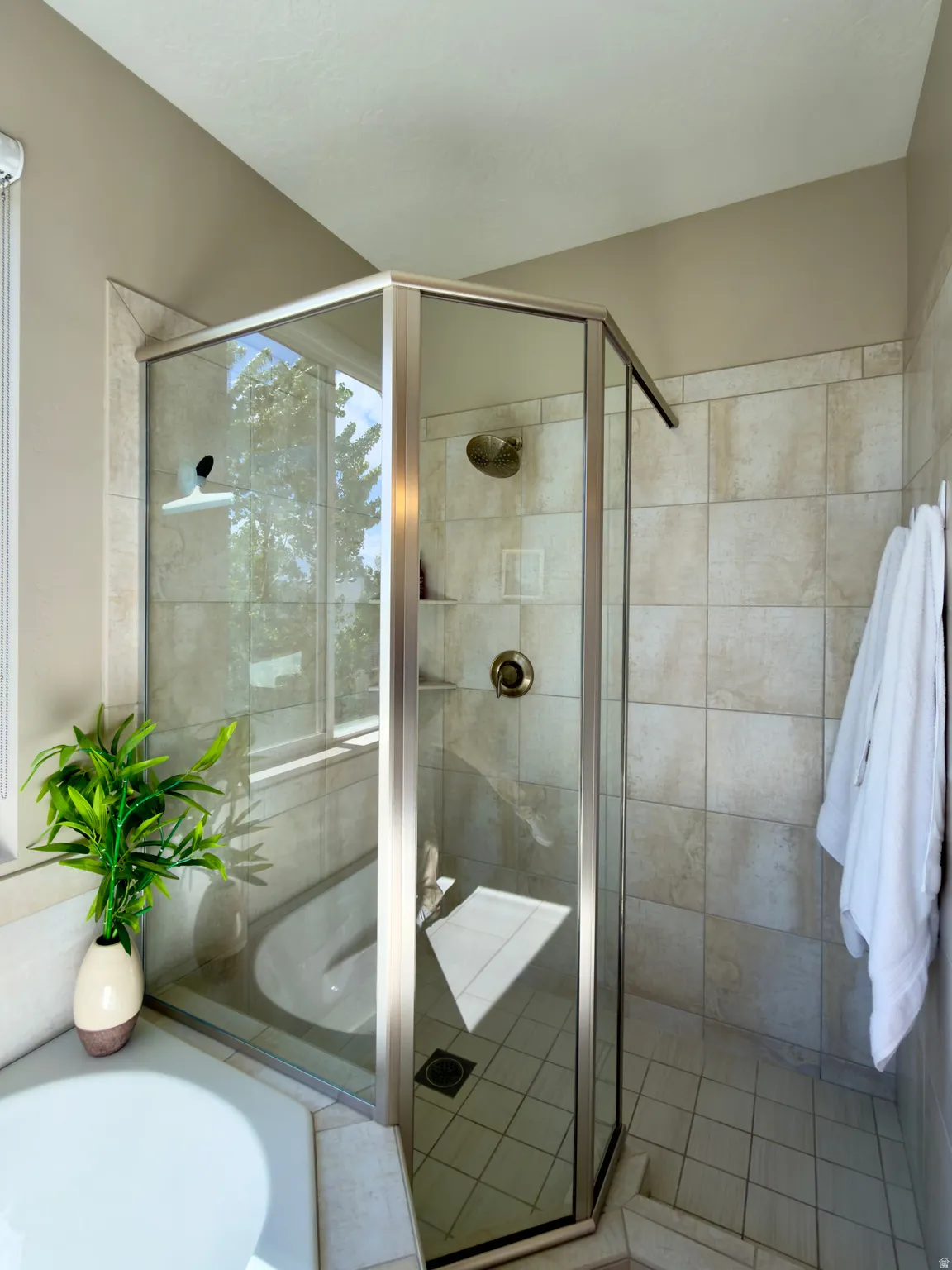 Full bathroom with a shower stall and a garden tub