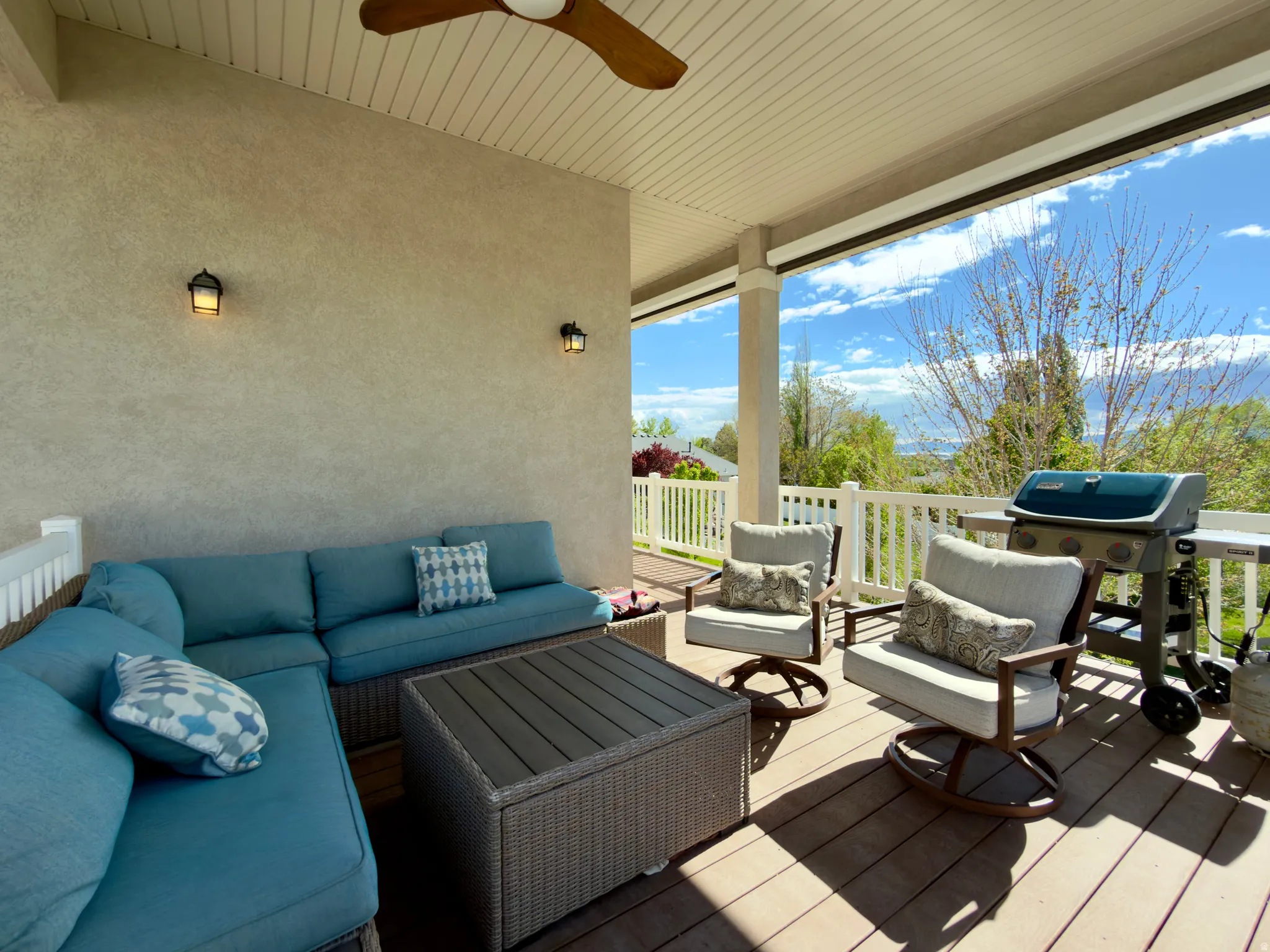 Deck featuring an outdoor living space, a ceiling fan, and a grill