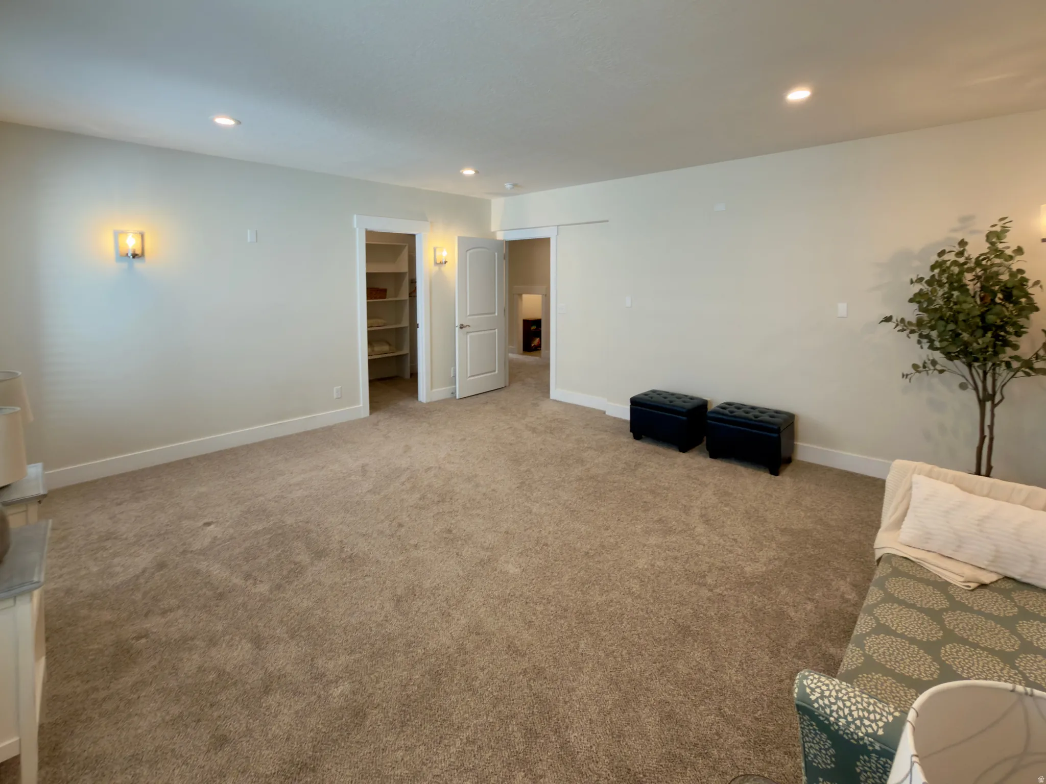 Sitting room with carpet floors and recessed lighting