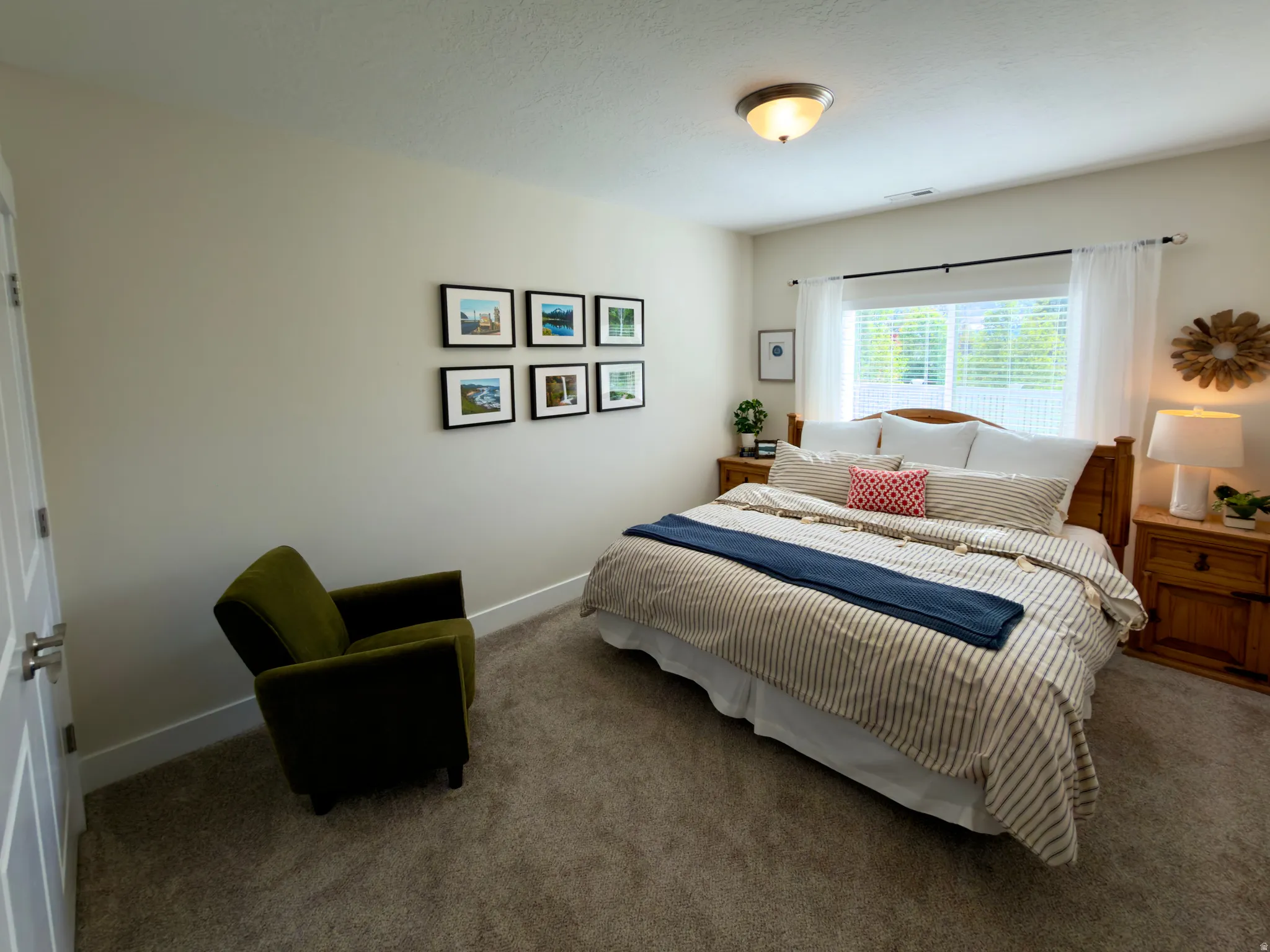 Carpeted bedroom featuring baseboards