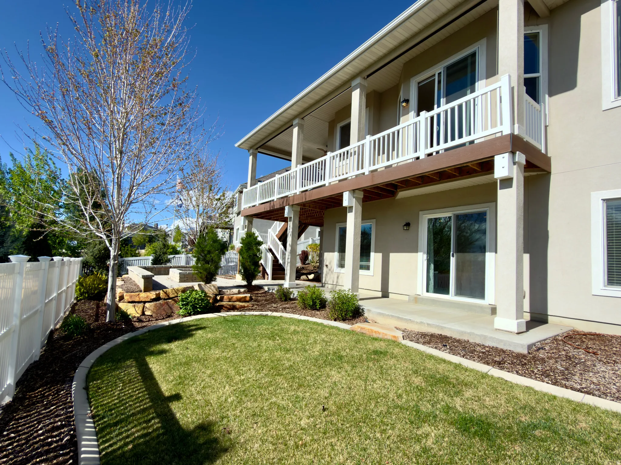 Back of property with a patio area and stucco siding