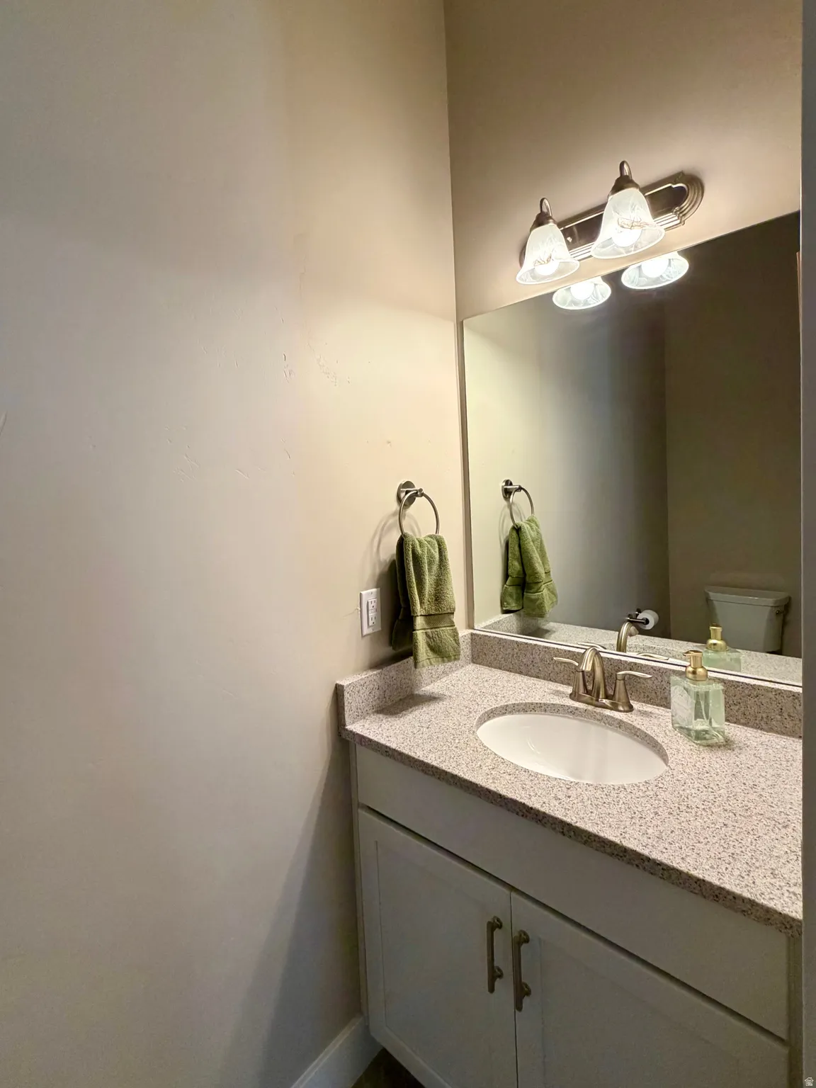 Bathroom with vanity and toilet