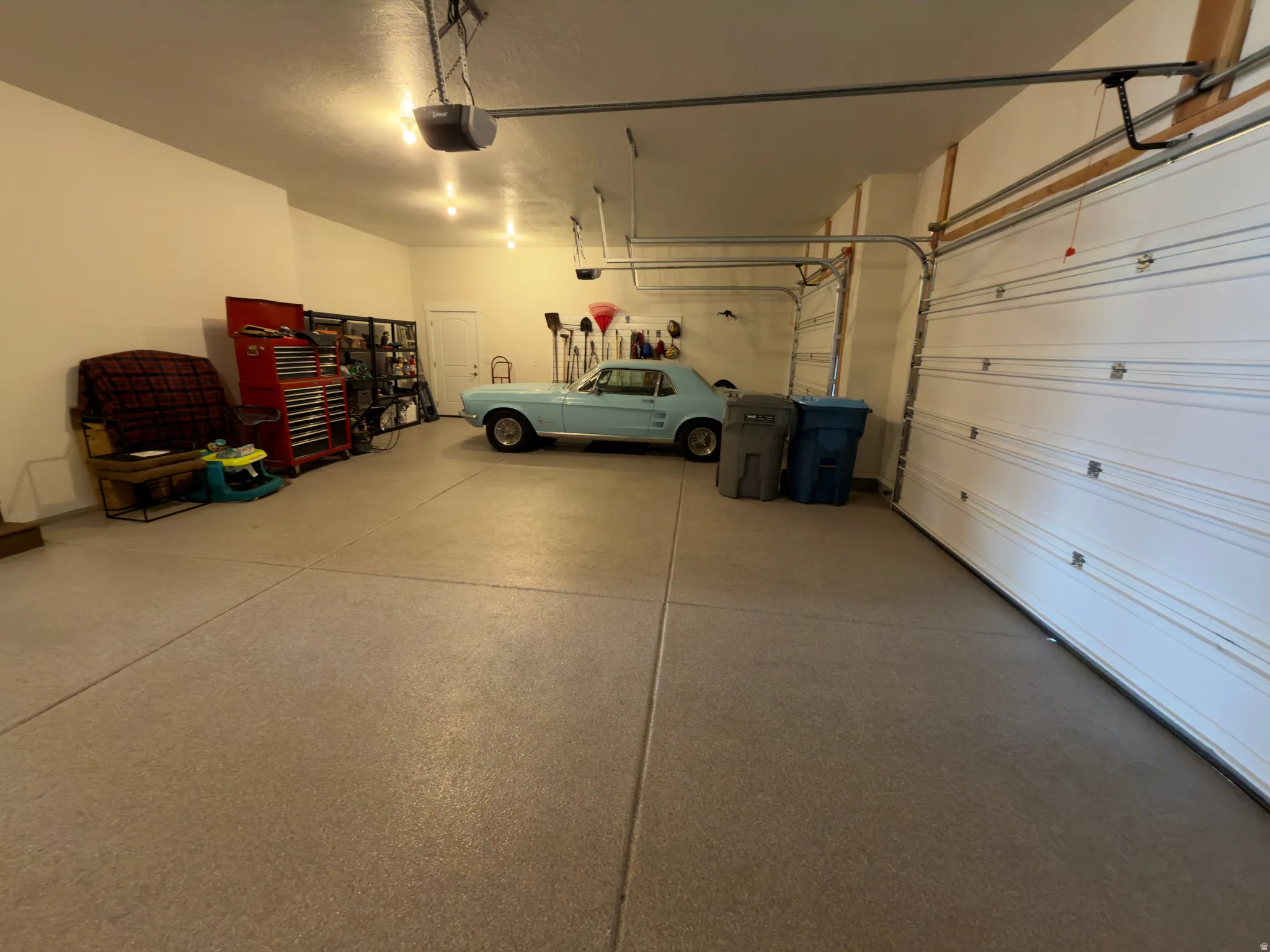 Garage featuring a garage door opener
