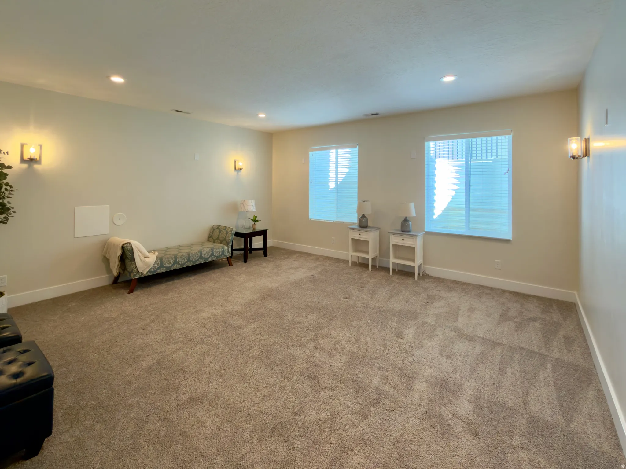 Sitting room featuring light carpet and recessed lighting