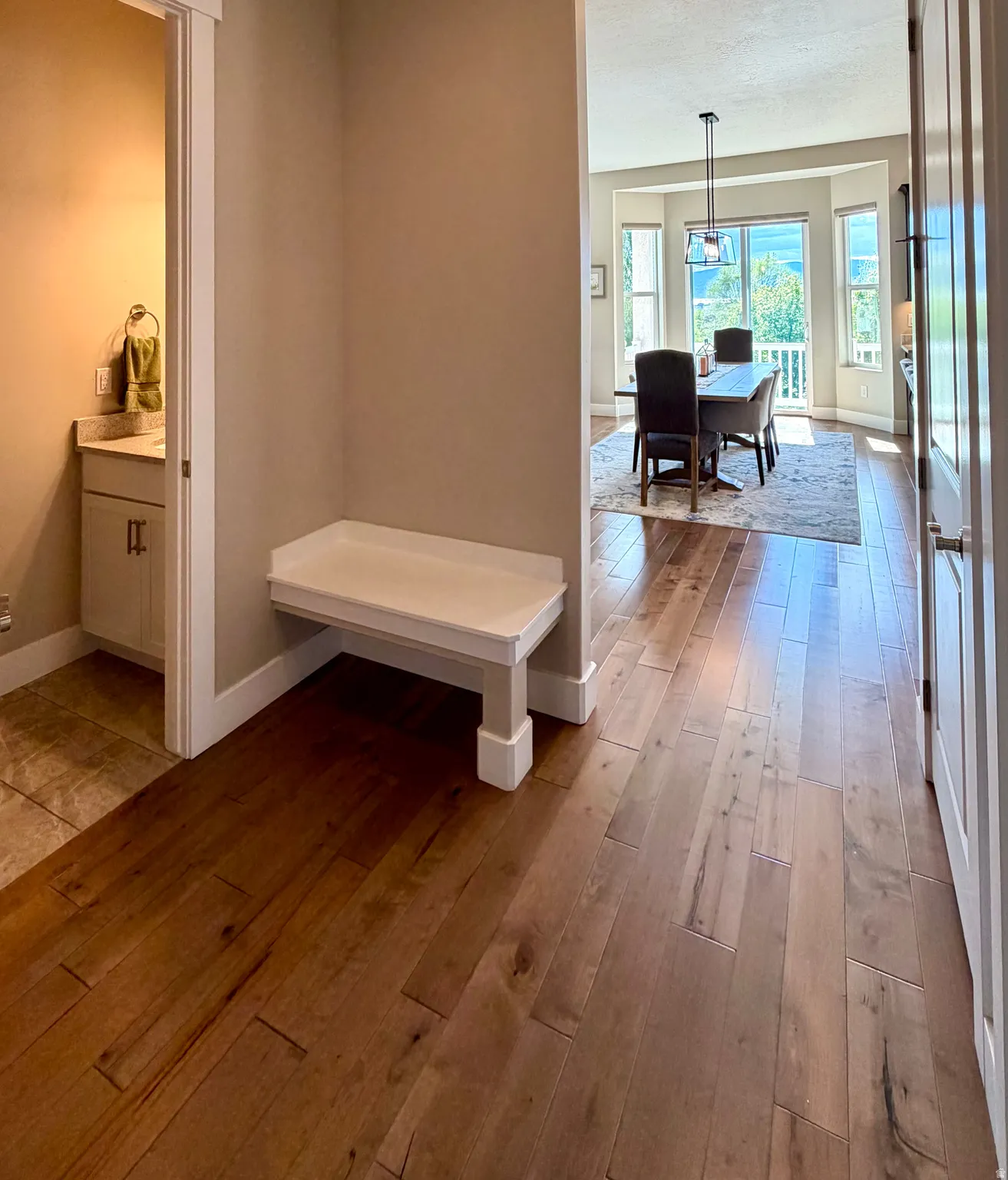 Mudroom with light wood-style flooring and baseboards