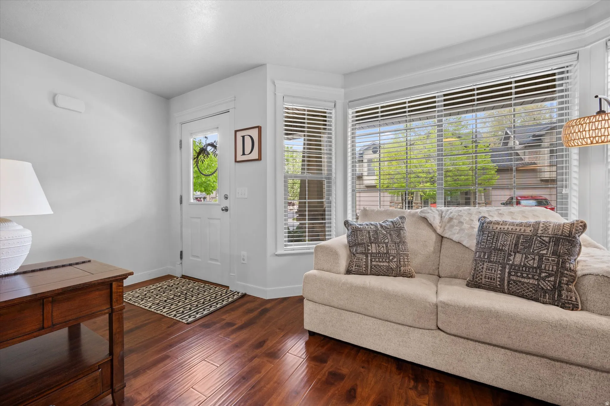 Entrance foyer with baseboard wood-style floors