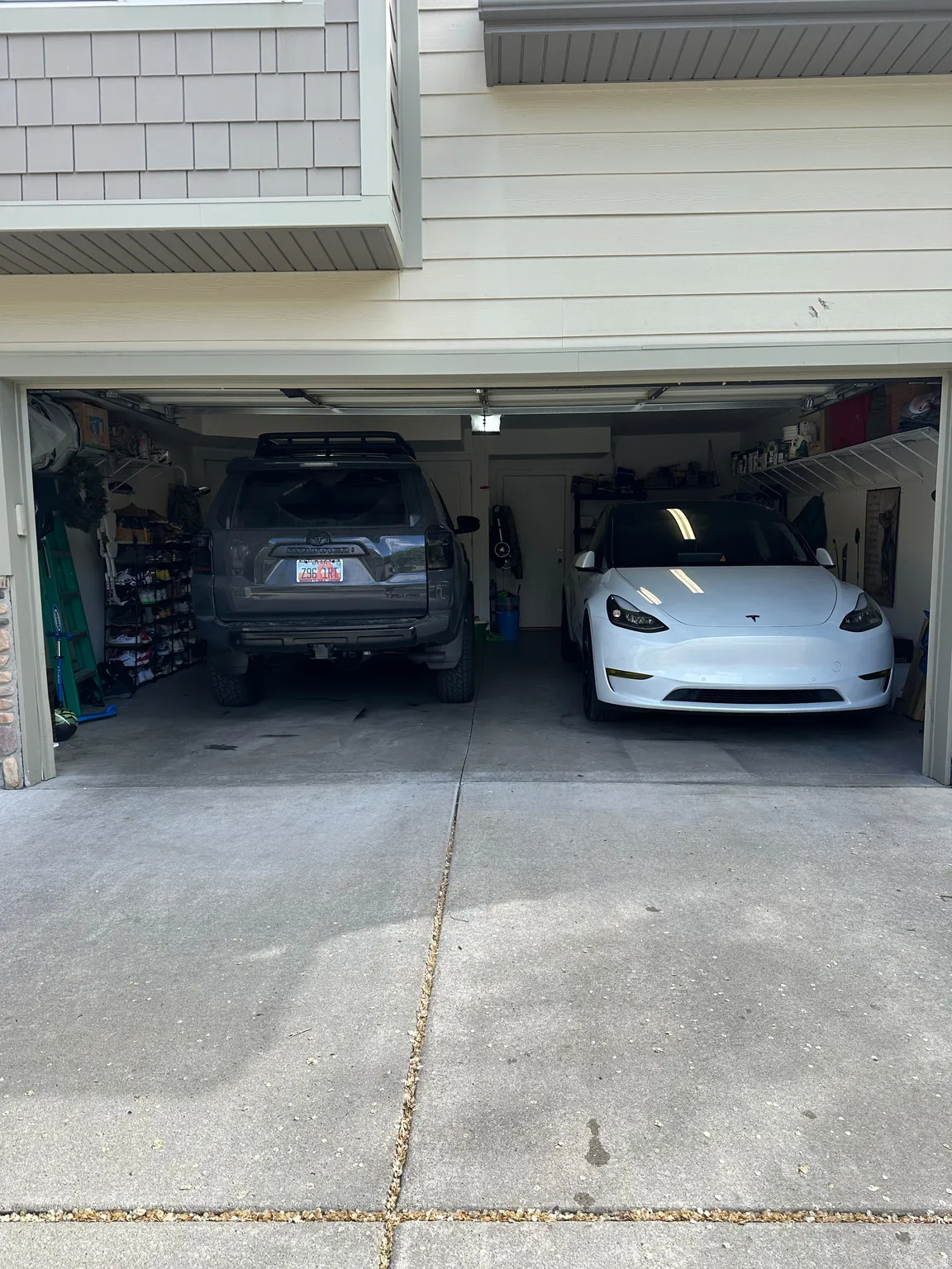 Garage with driveway  Garage door opener and room for Two cars