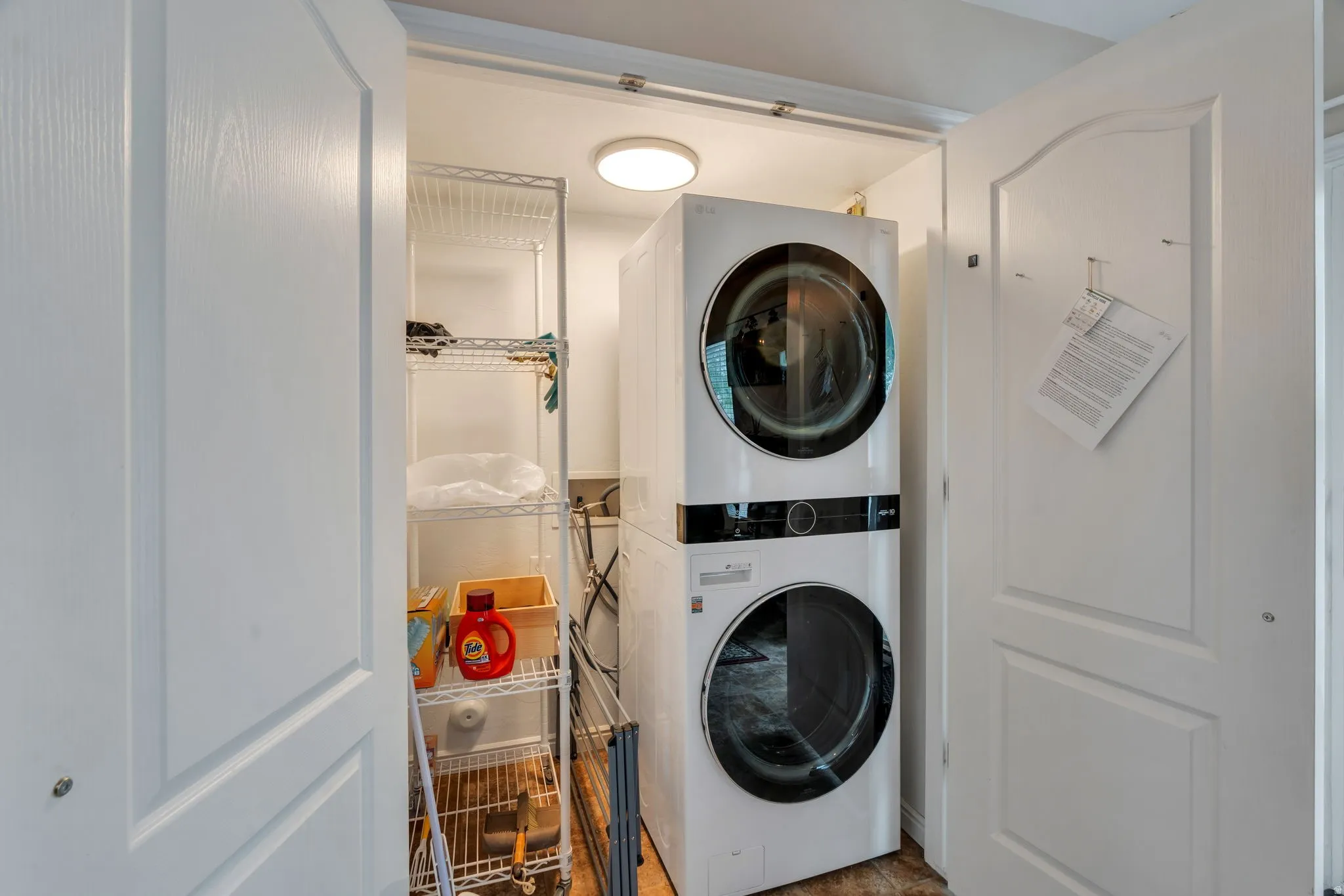 Laundry area with stacked washer / drying machine