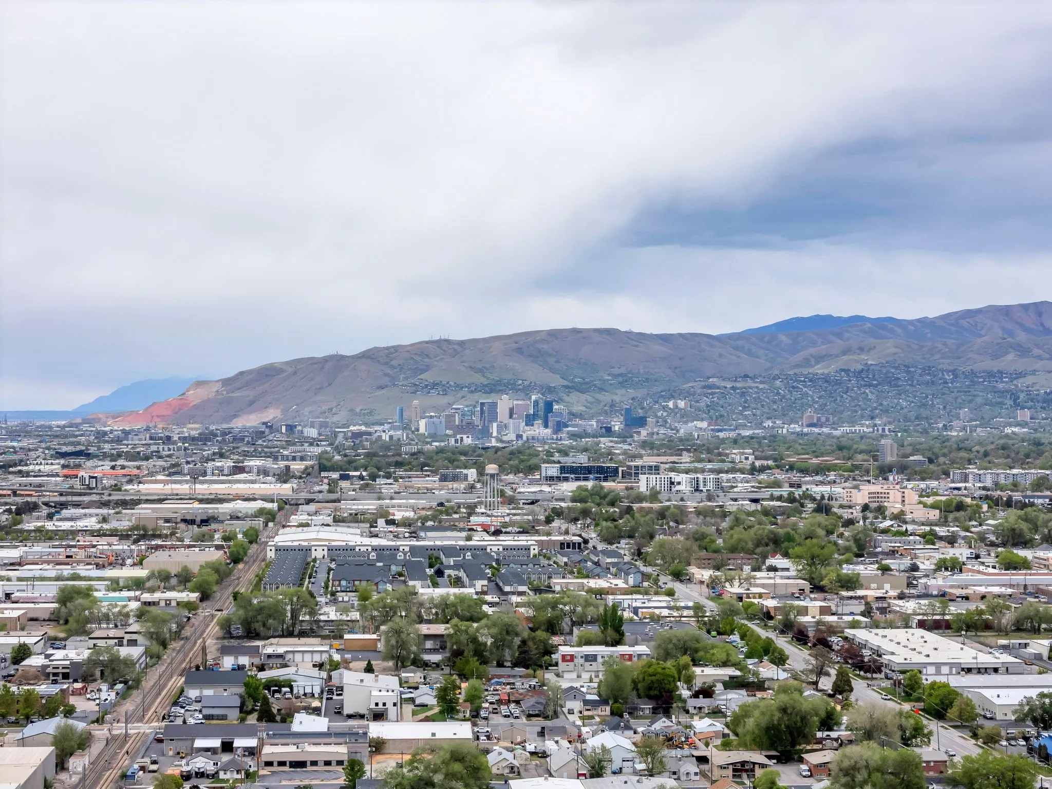 View of mountain backdrop featuring nearby urban area