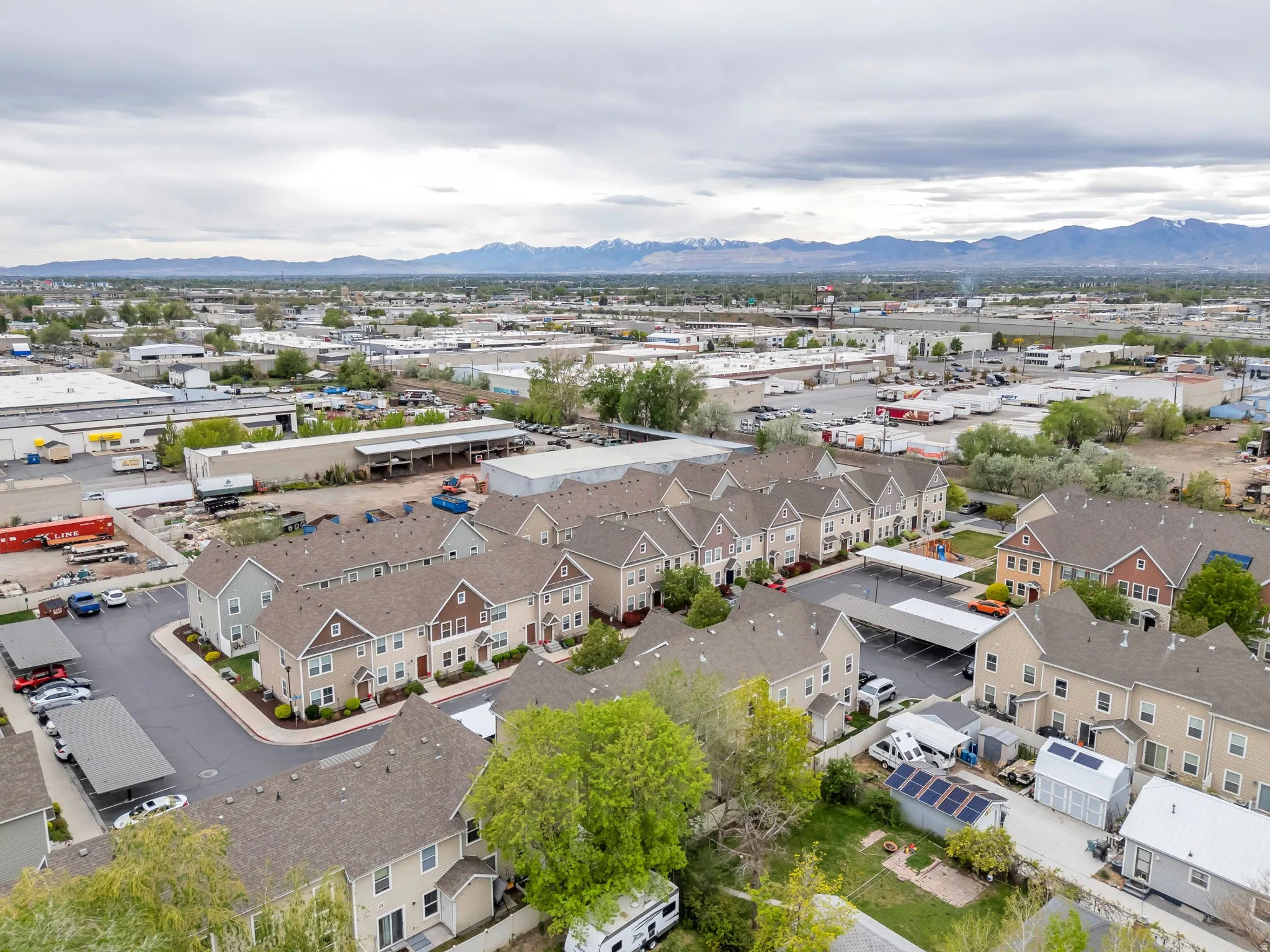 Aerial perspective of suburban area with a mountain backdrop