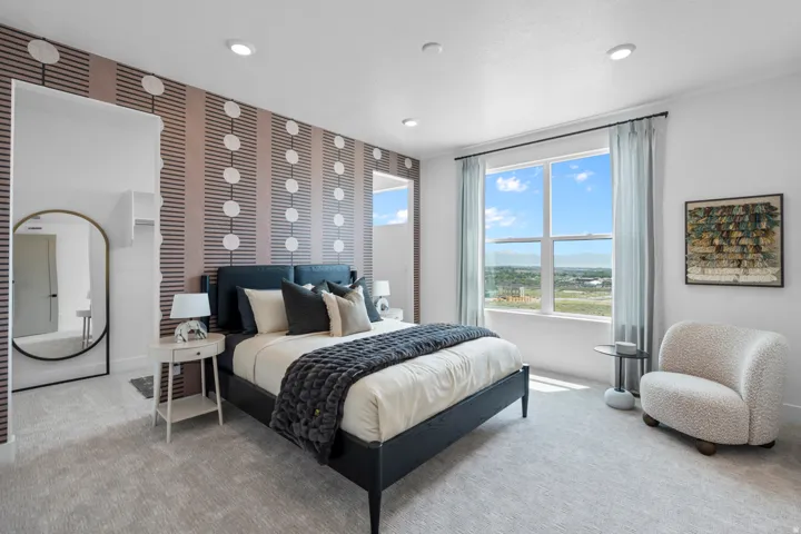 Bedroom with light colored carpet and recessed lighting