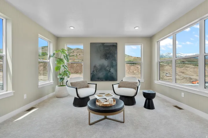 Living area with carpet and a mountain view