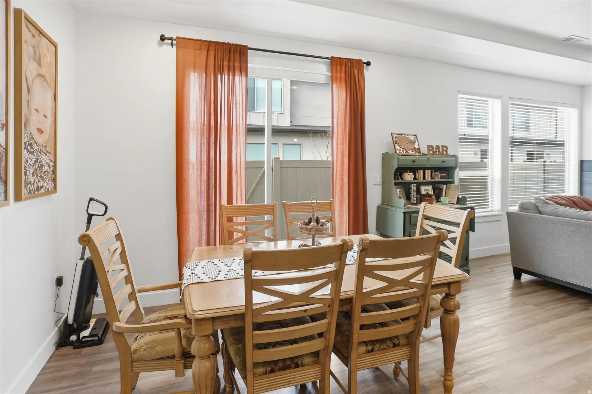 Dining area with baseboards and wood finished floors