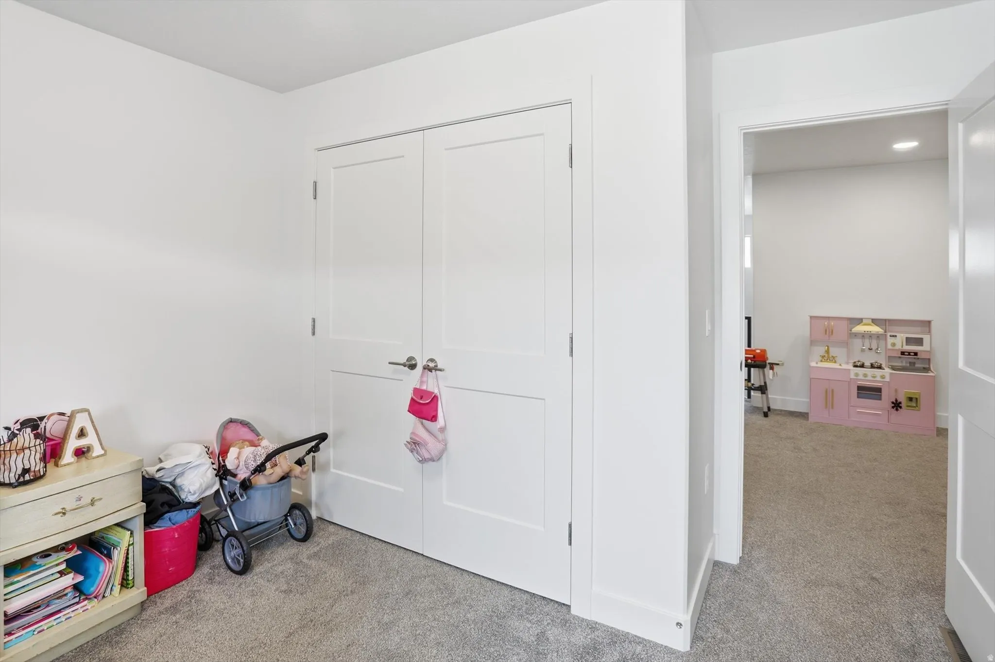 Rec room featuring light colored carpet