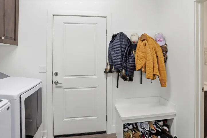 Laundry area with cabinet space and washing machine and clothes dryer