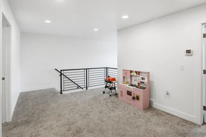 Game room featuring light colored carpet and recessed lighting