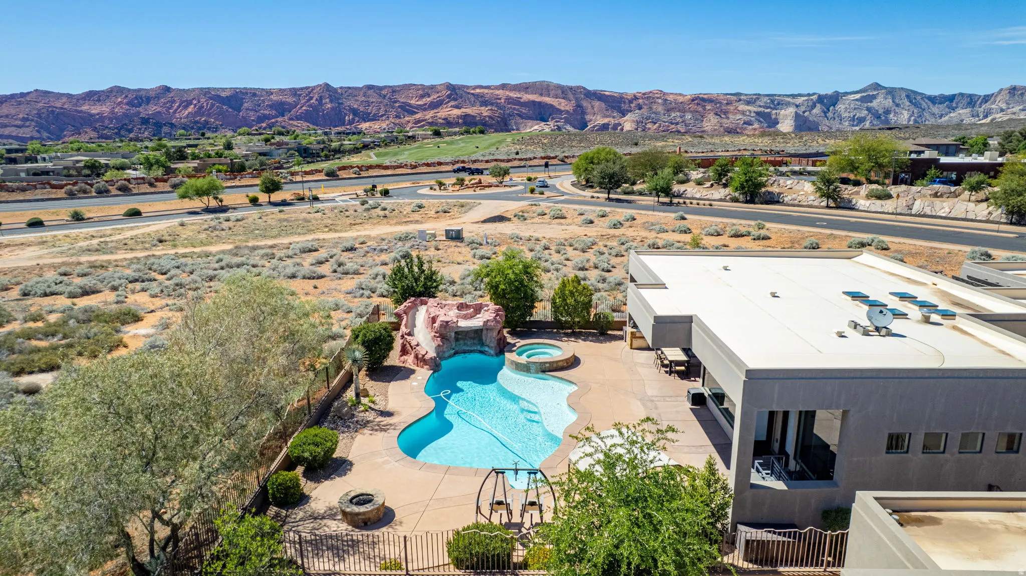 Bird's eye view of a mountainous background and a pool