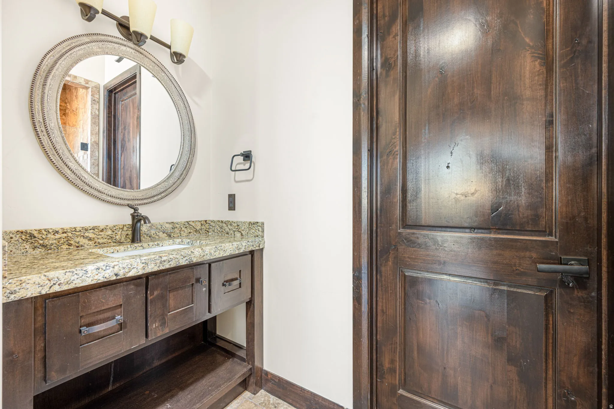 Bathroom with vanity and baseboards