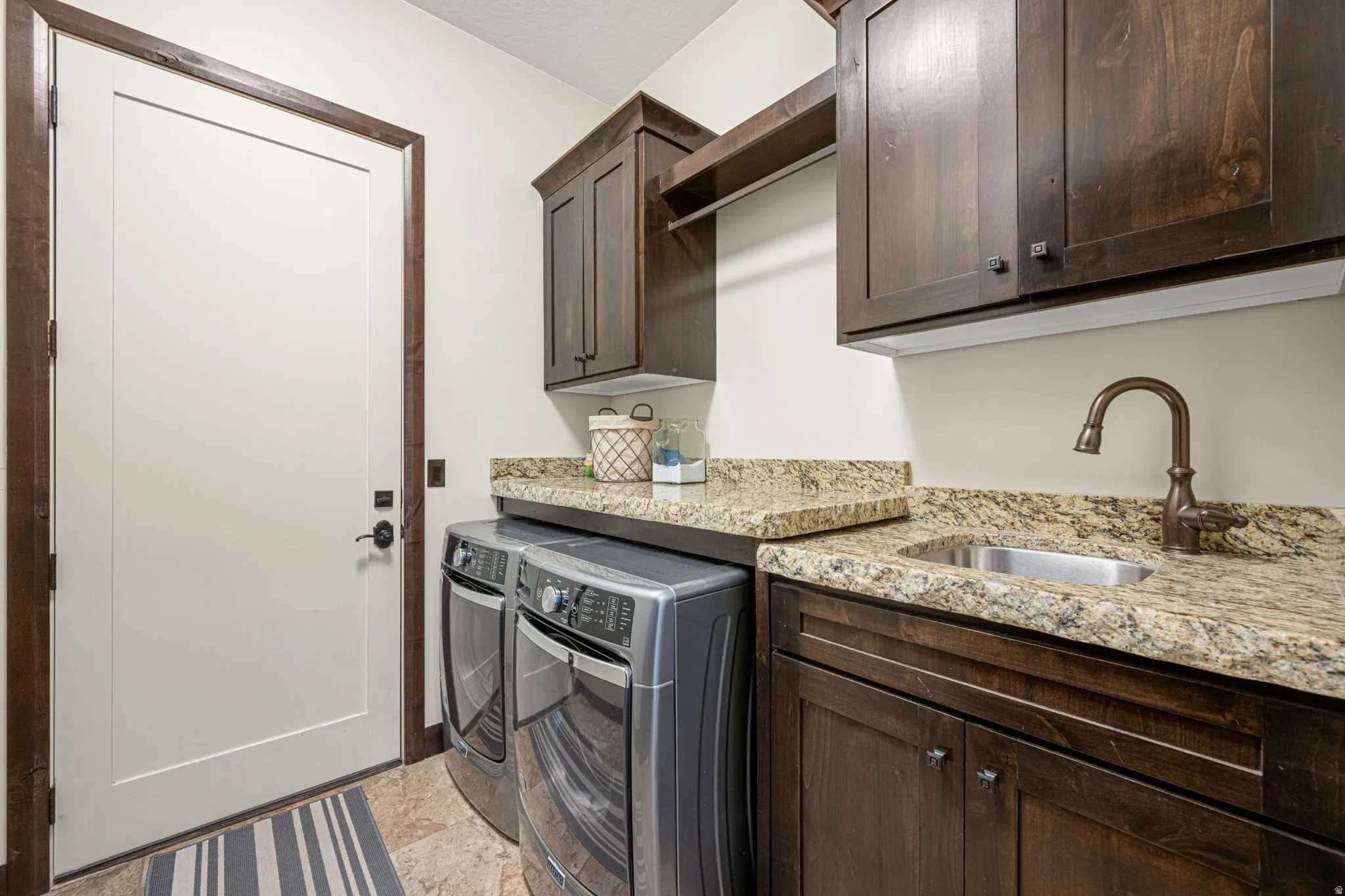 Laundry area with cabinet space and washer and dryer