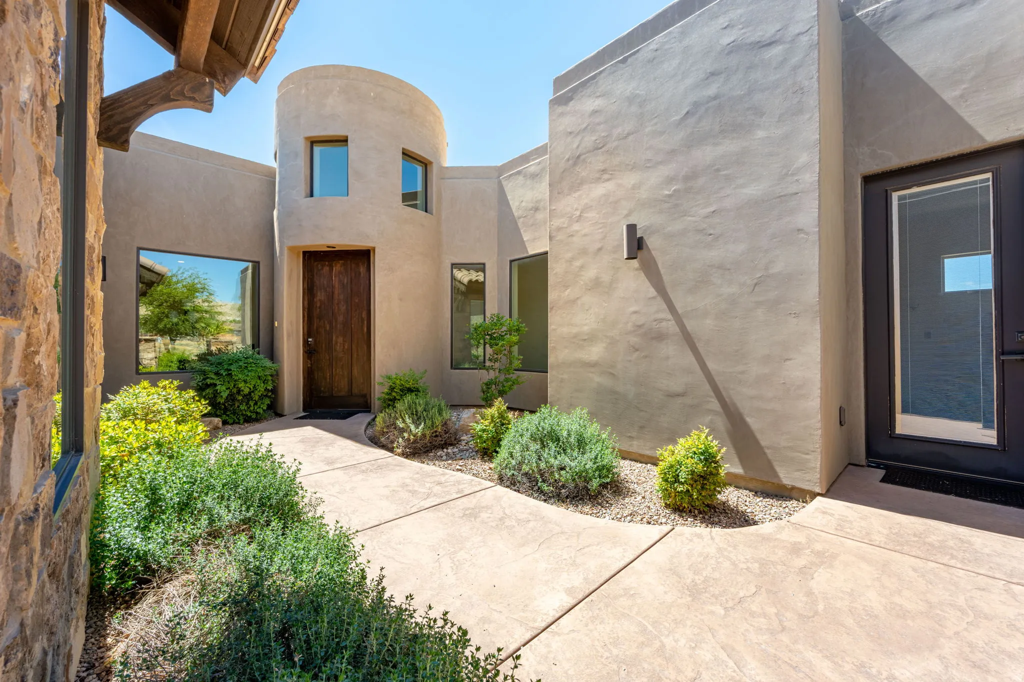 Property entrance featuring stucco siding
