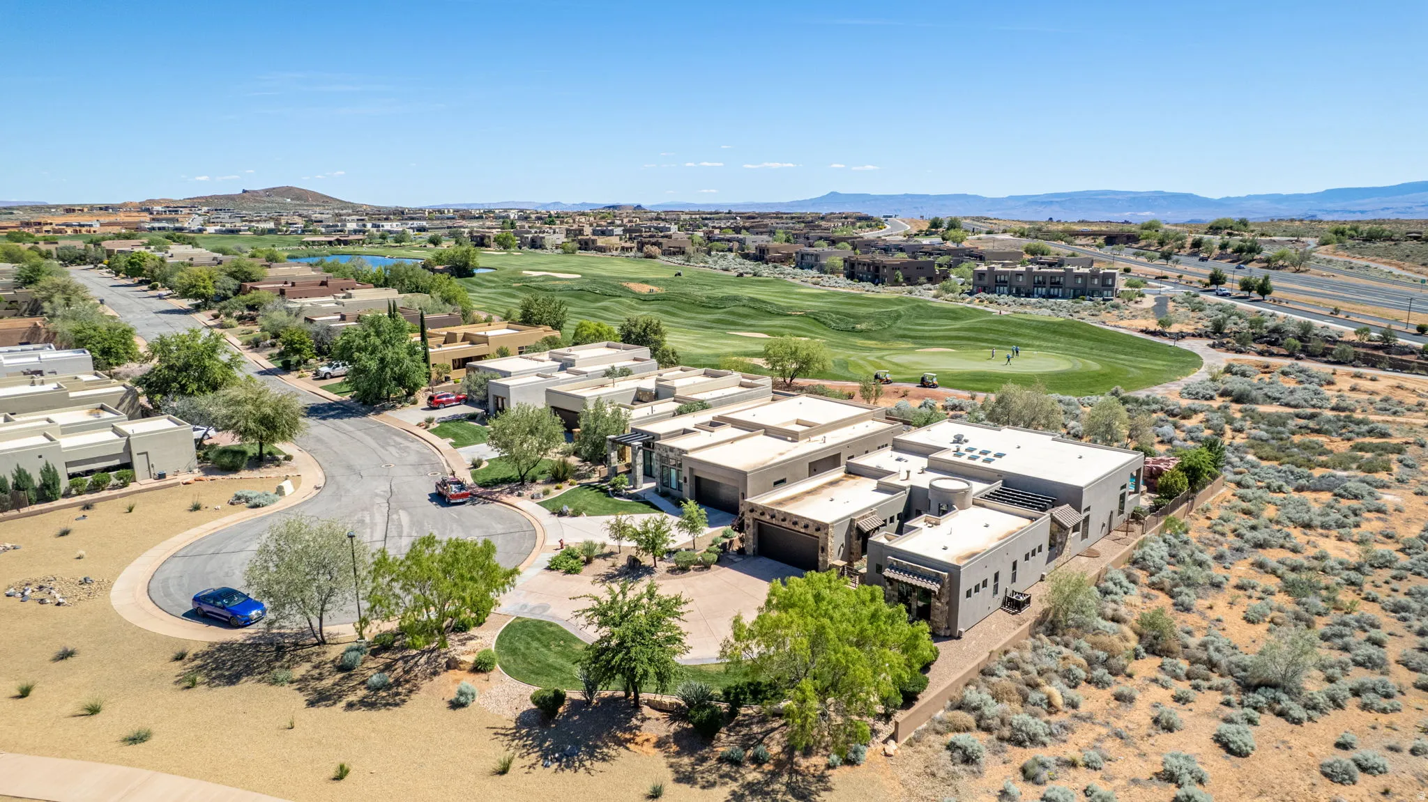 Aerial view of mountains and a golf club
