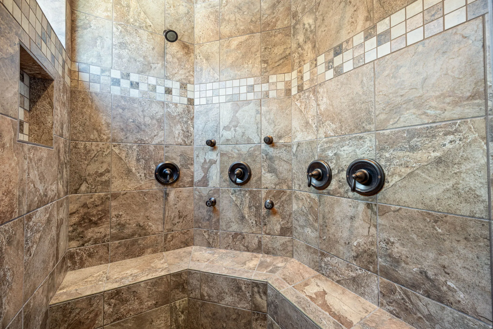 Full bathroom with tiled shower