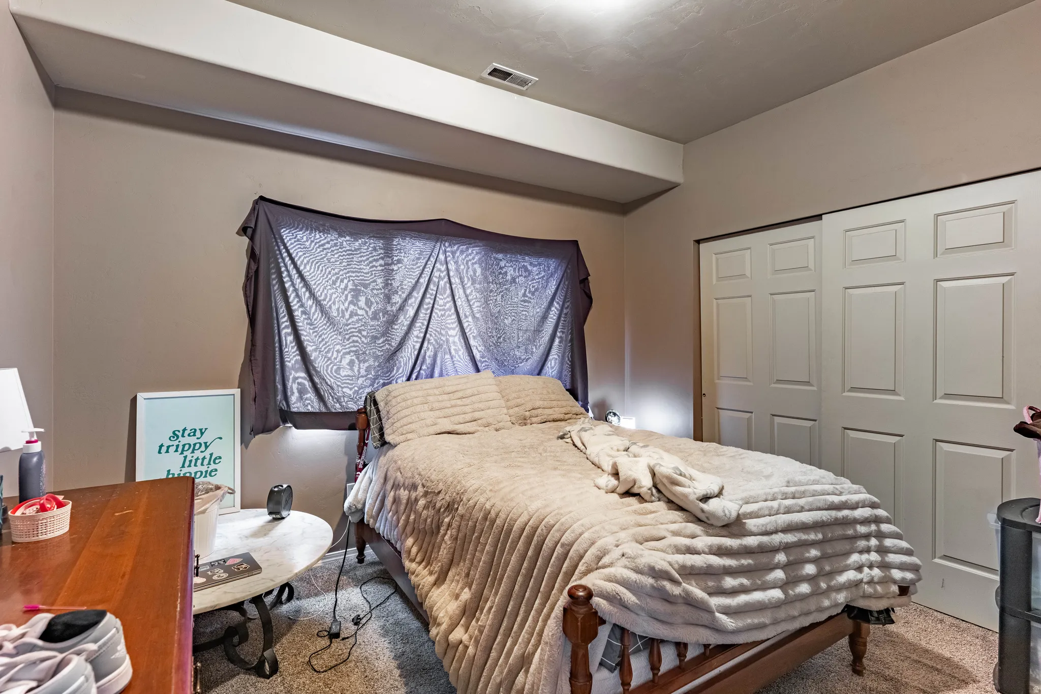 Bedroom featuring carpet floors and a closet