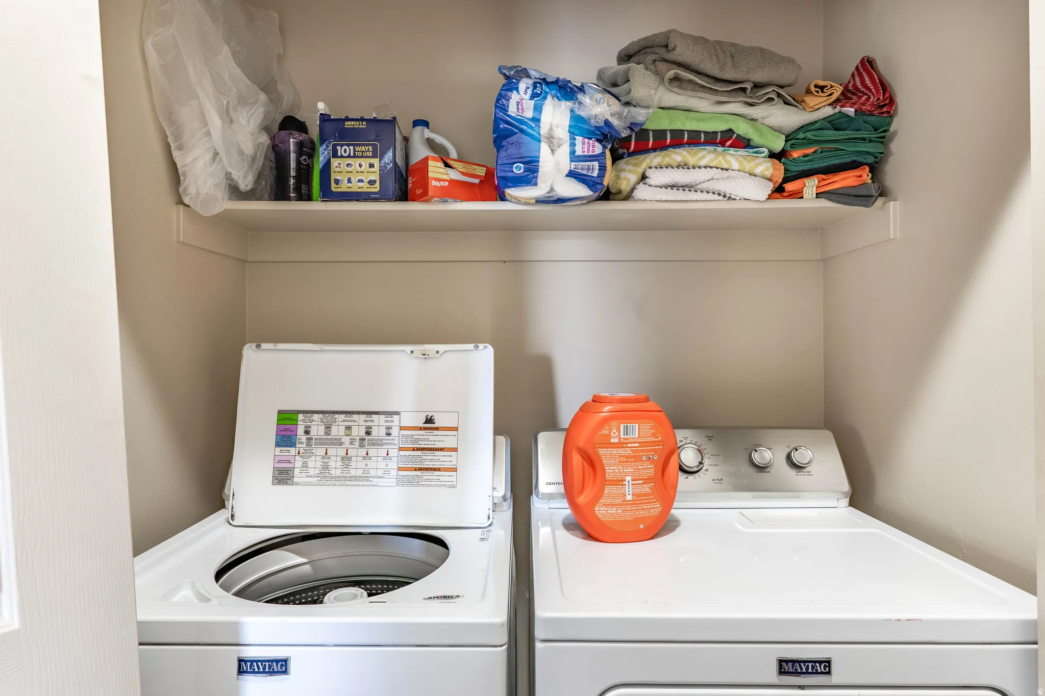 Laundry area featuring washing machine and clothes dryer