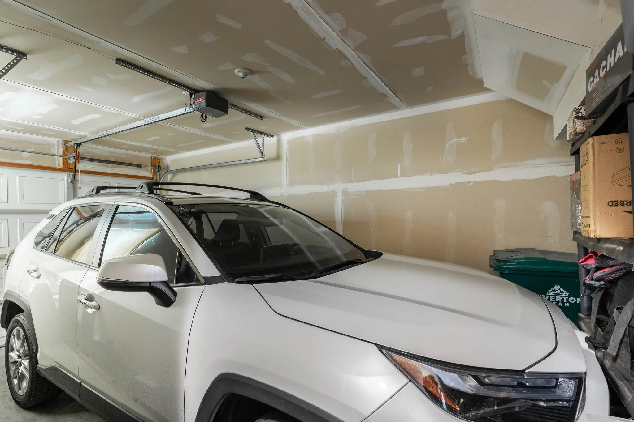 Garage featuring a garage door opener