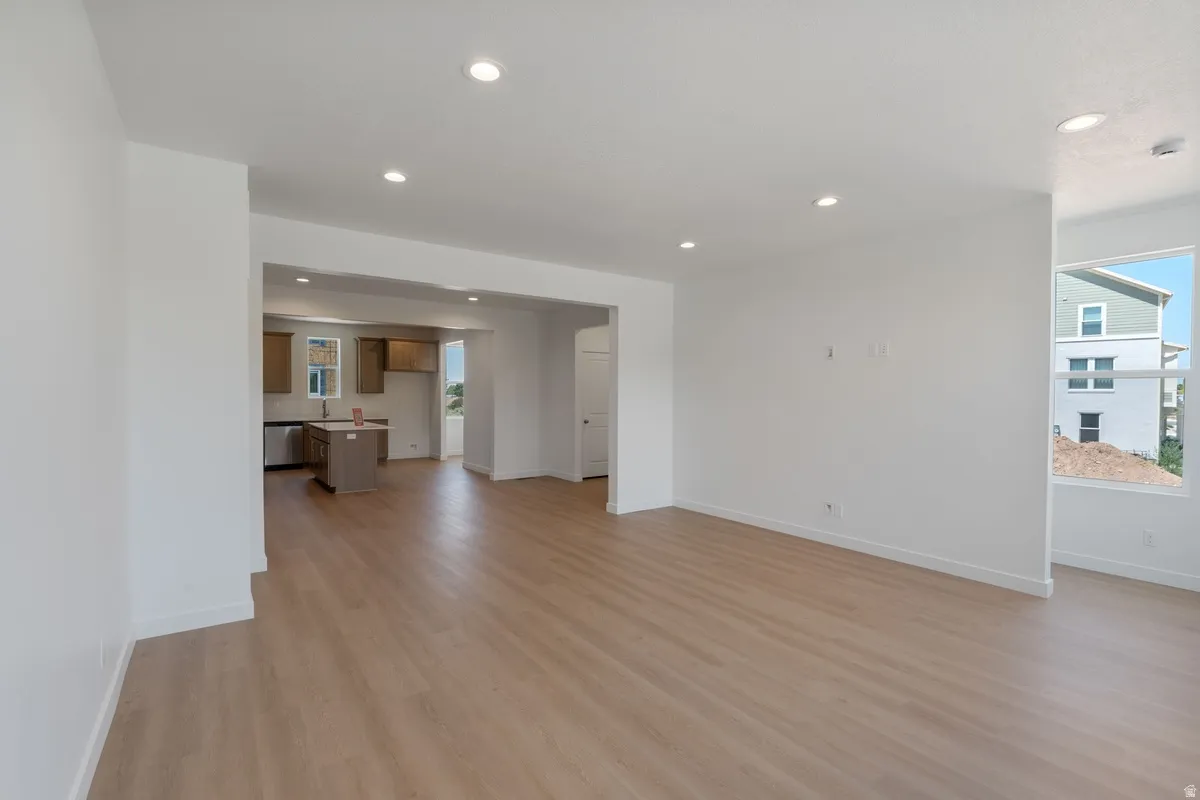 Unfurnished living room with light wood-style floors and recessed lighting