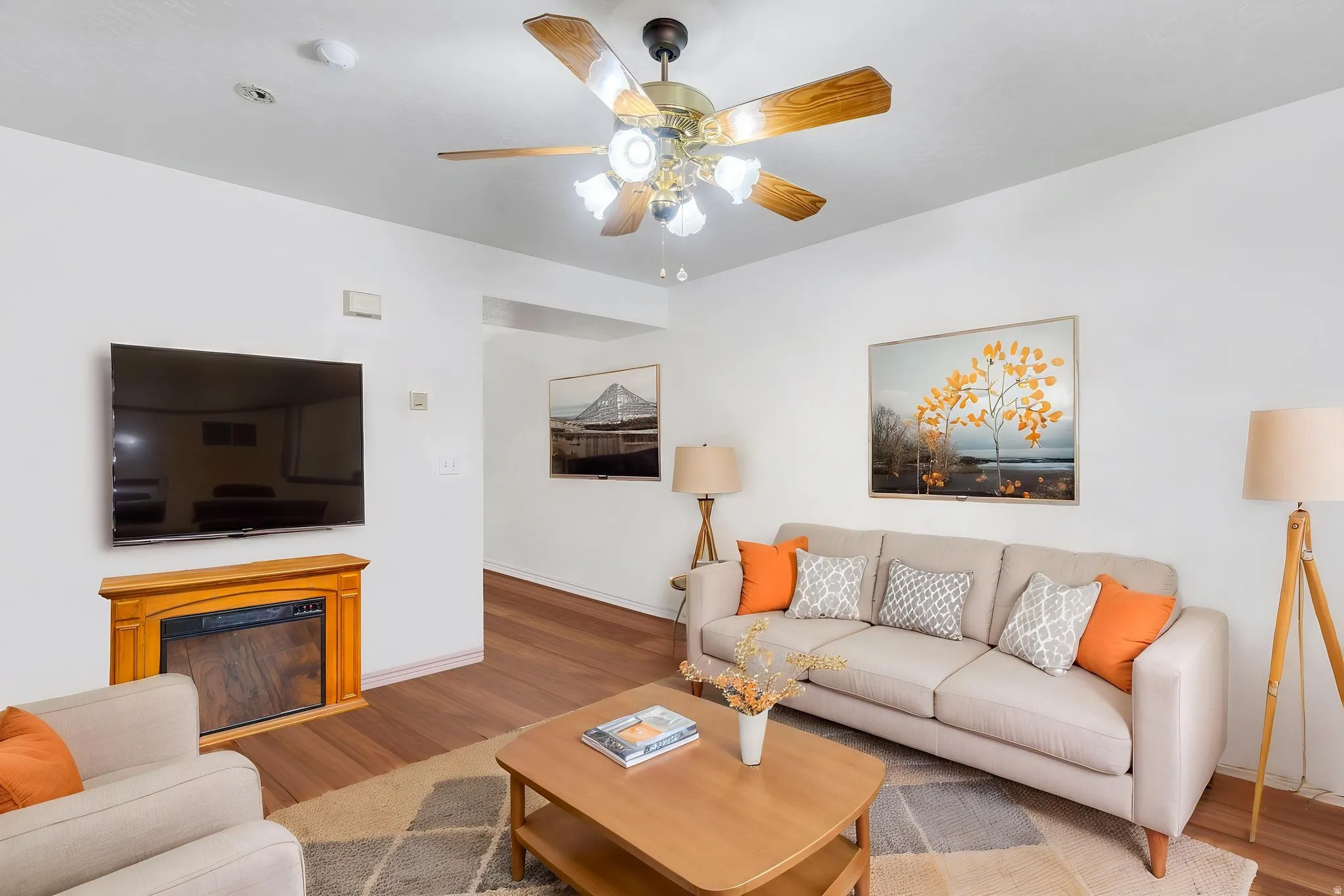 Living room with gas fireplace, digitally staged