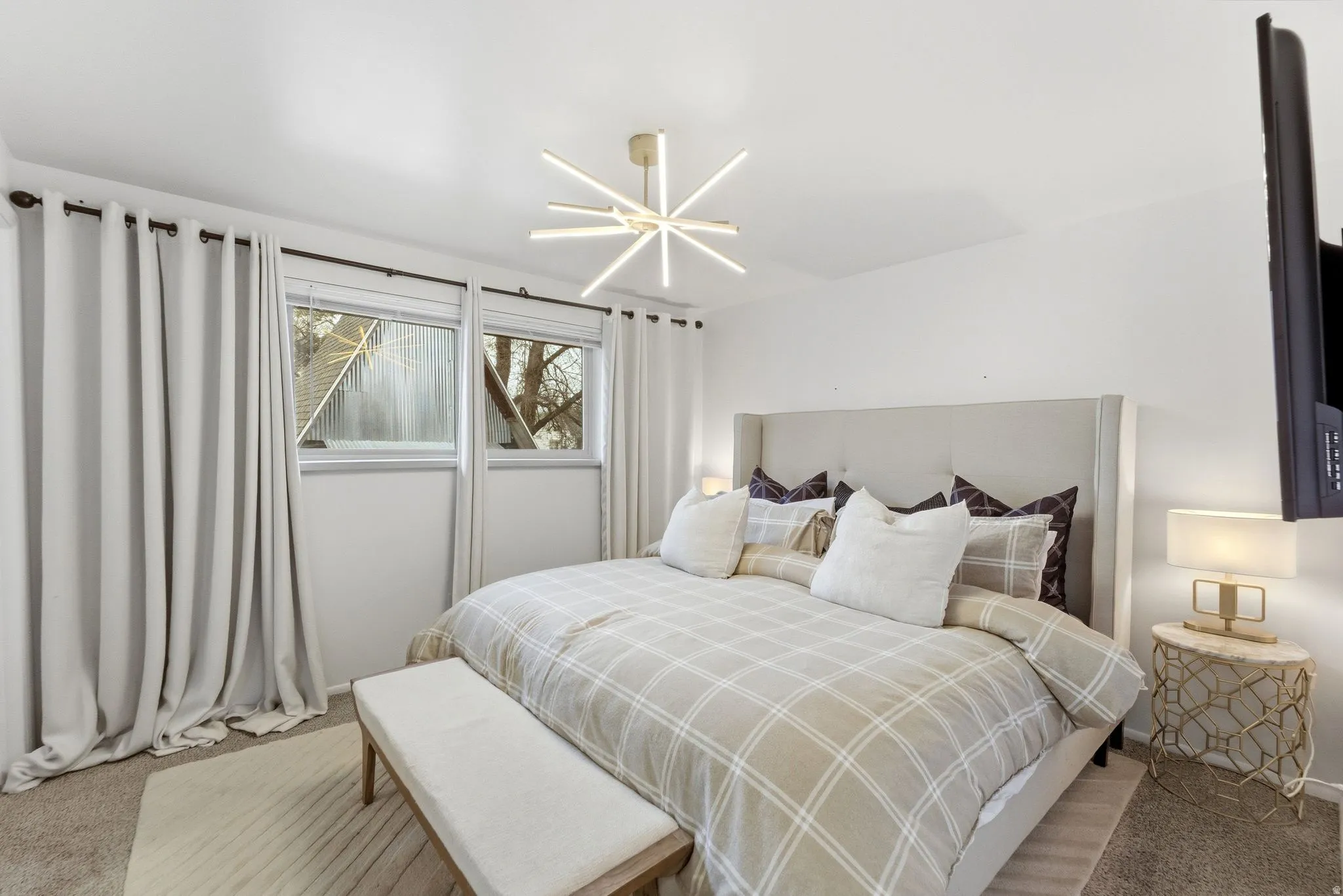 Bedroom with light carpet
