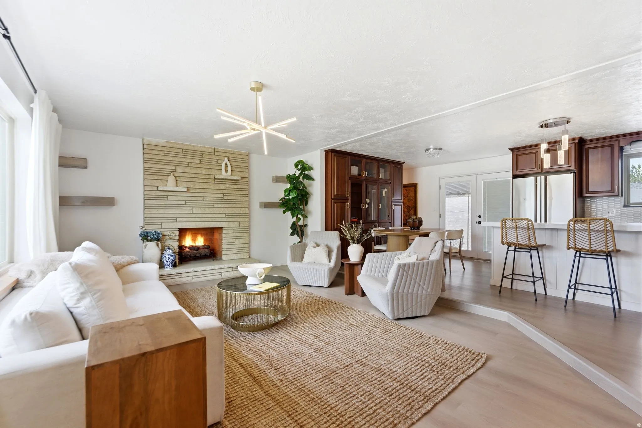 Living area featuring a fireplace and light wood-style flooring