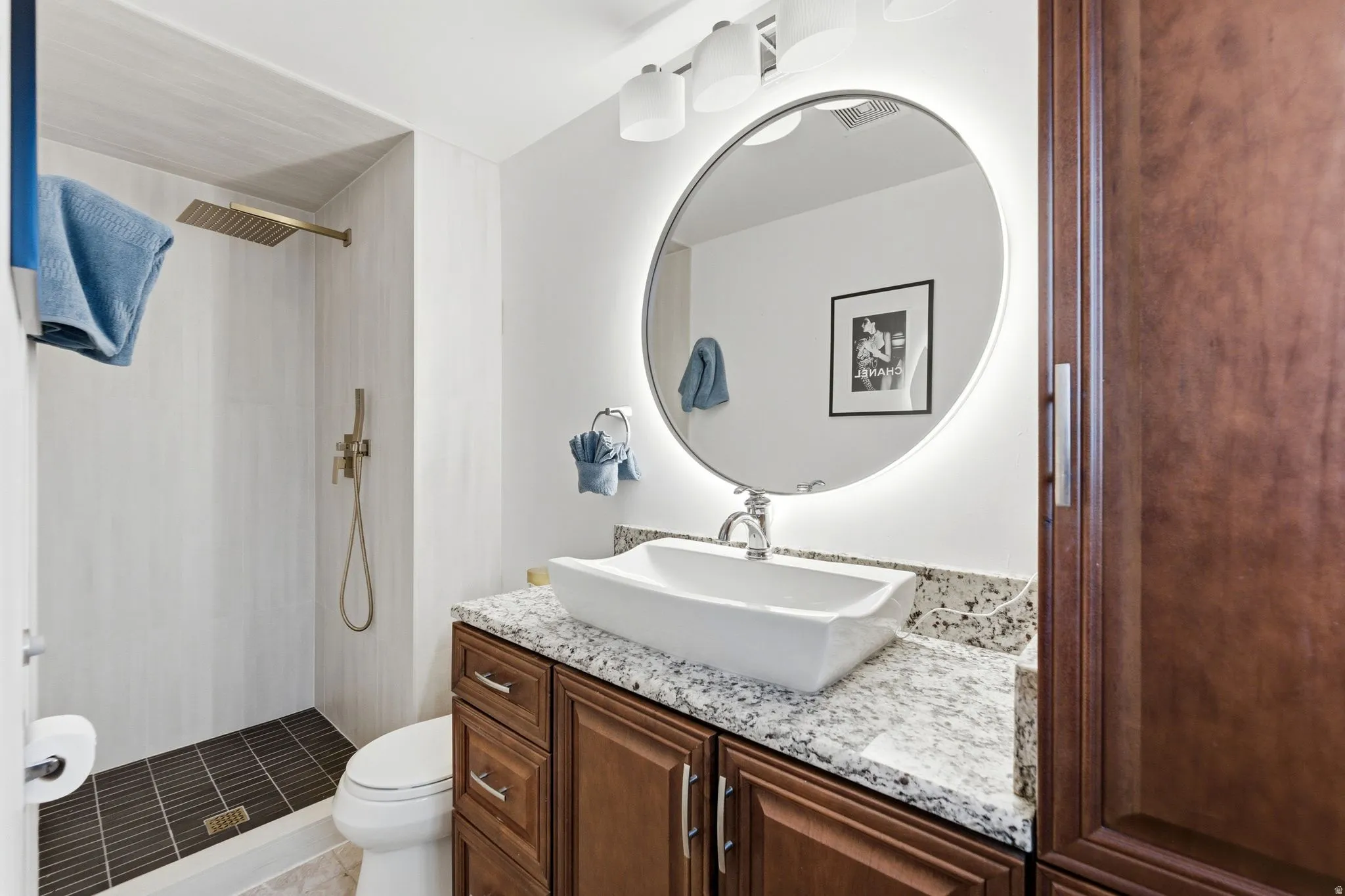 Full bath with vanity and a stall shower