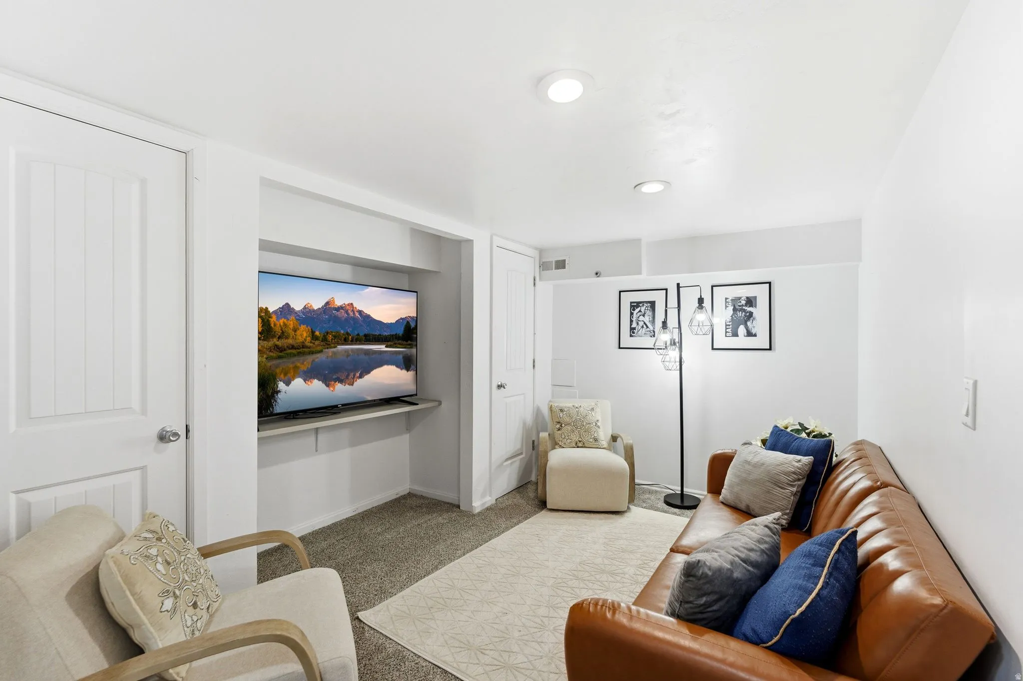 Living area with carpet floors and baseboards