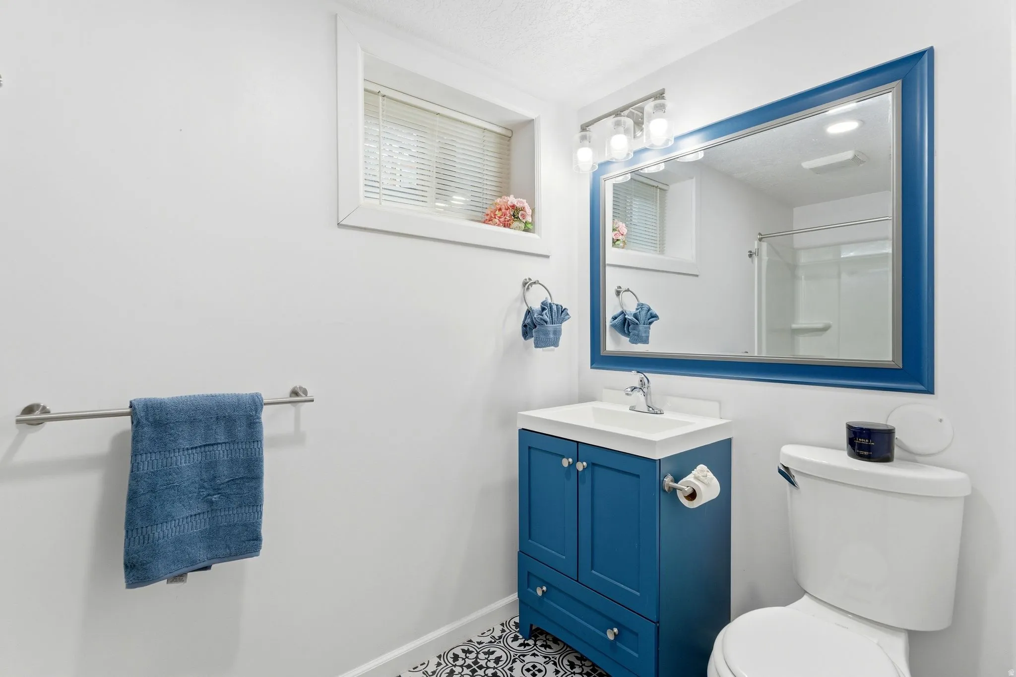 Bathroom with vanity and a shower